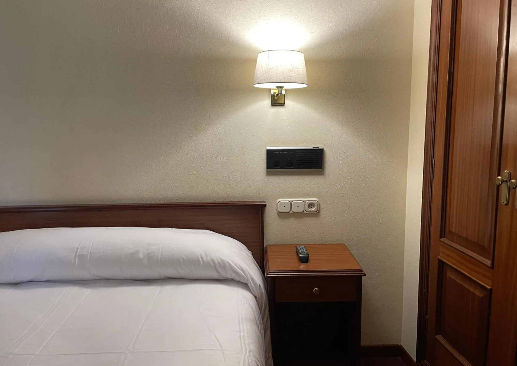 Bed in Pensión Capital de Galicia