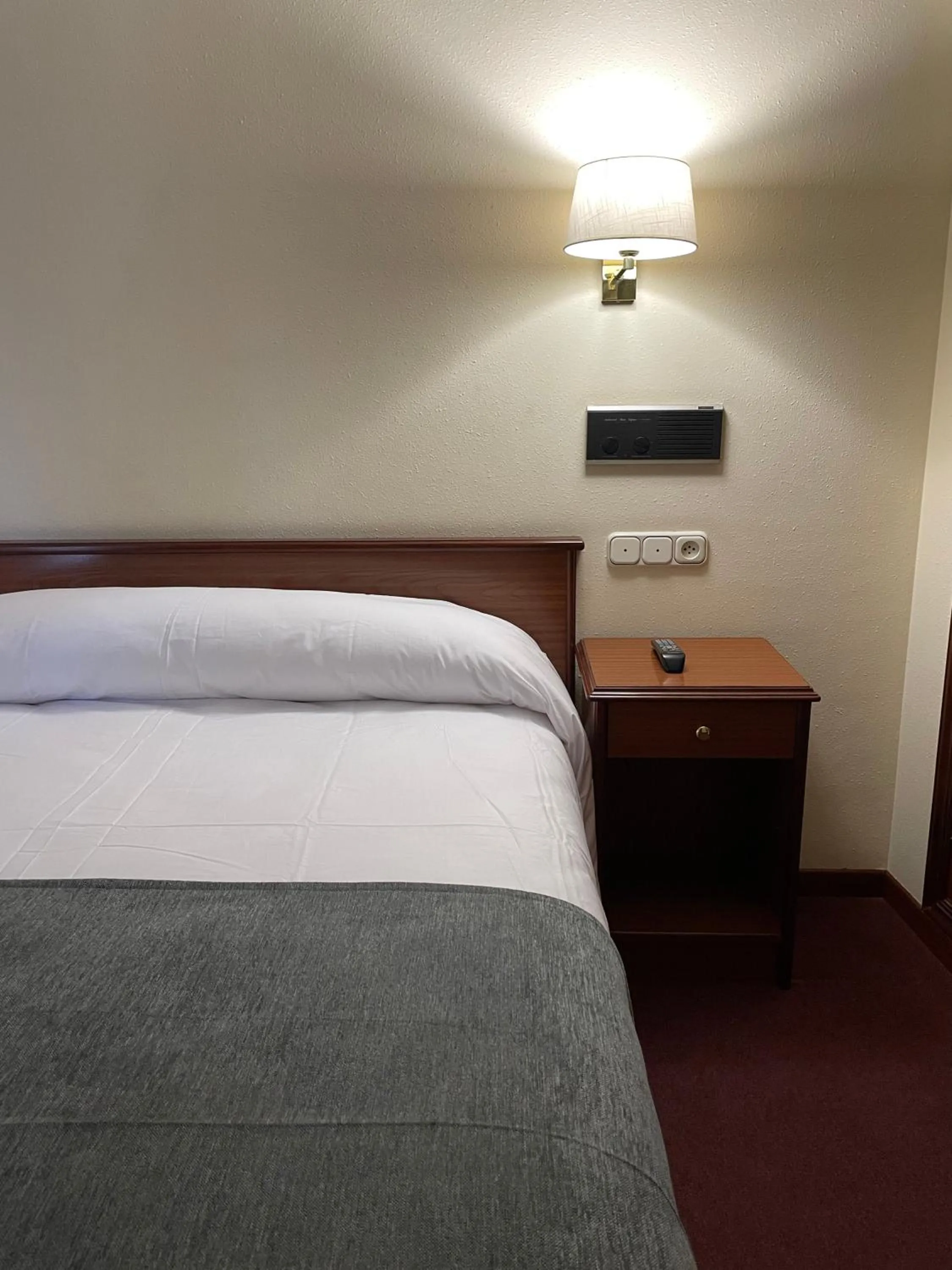 Bed in Pensión Capital de Galicia