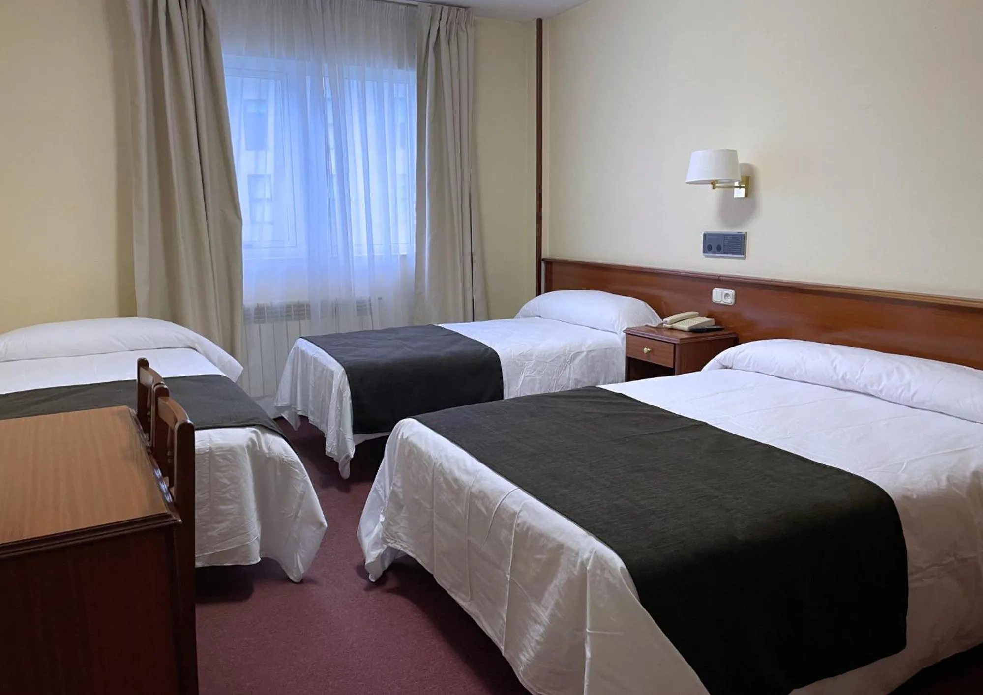Bed in Pensión Capital de Galicia