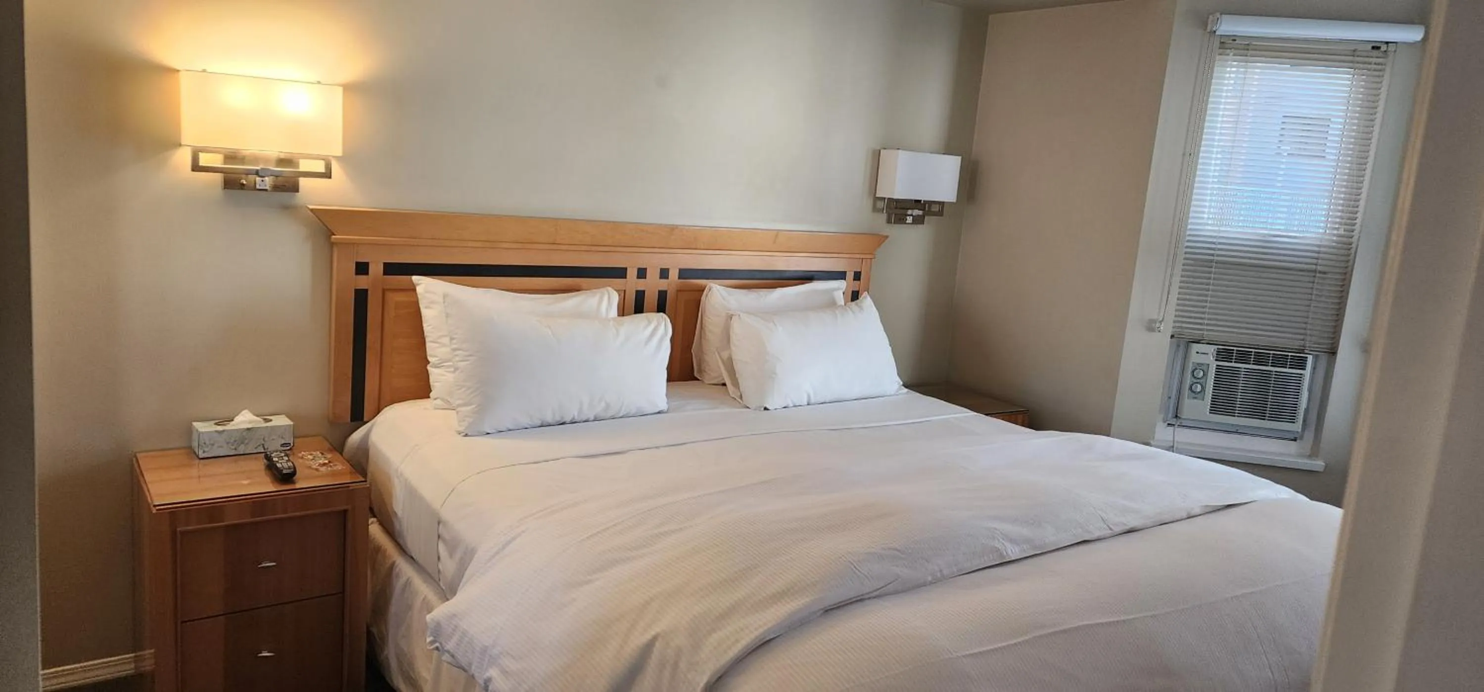 Bed in Times Square Suites Hotel