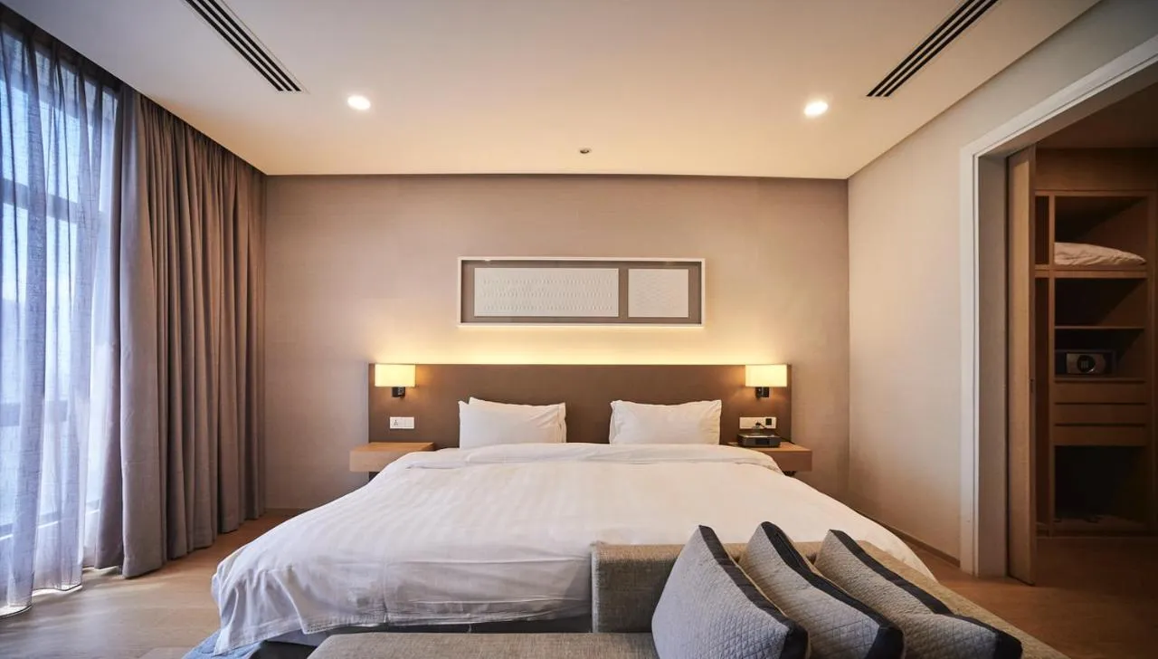 Bed in 188 Suites by NamaStay