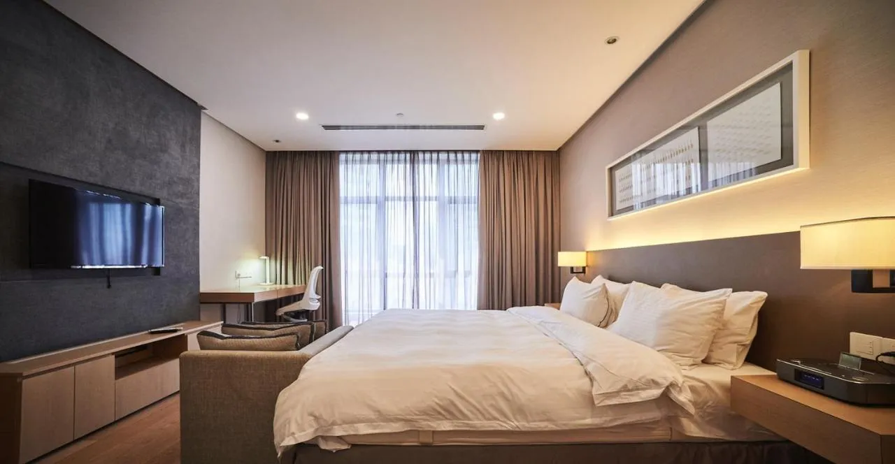 Bed in 188 Suites by NamaStay