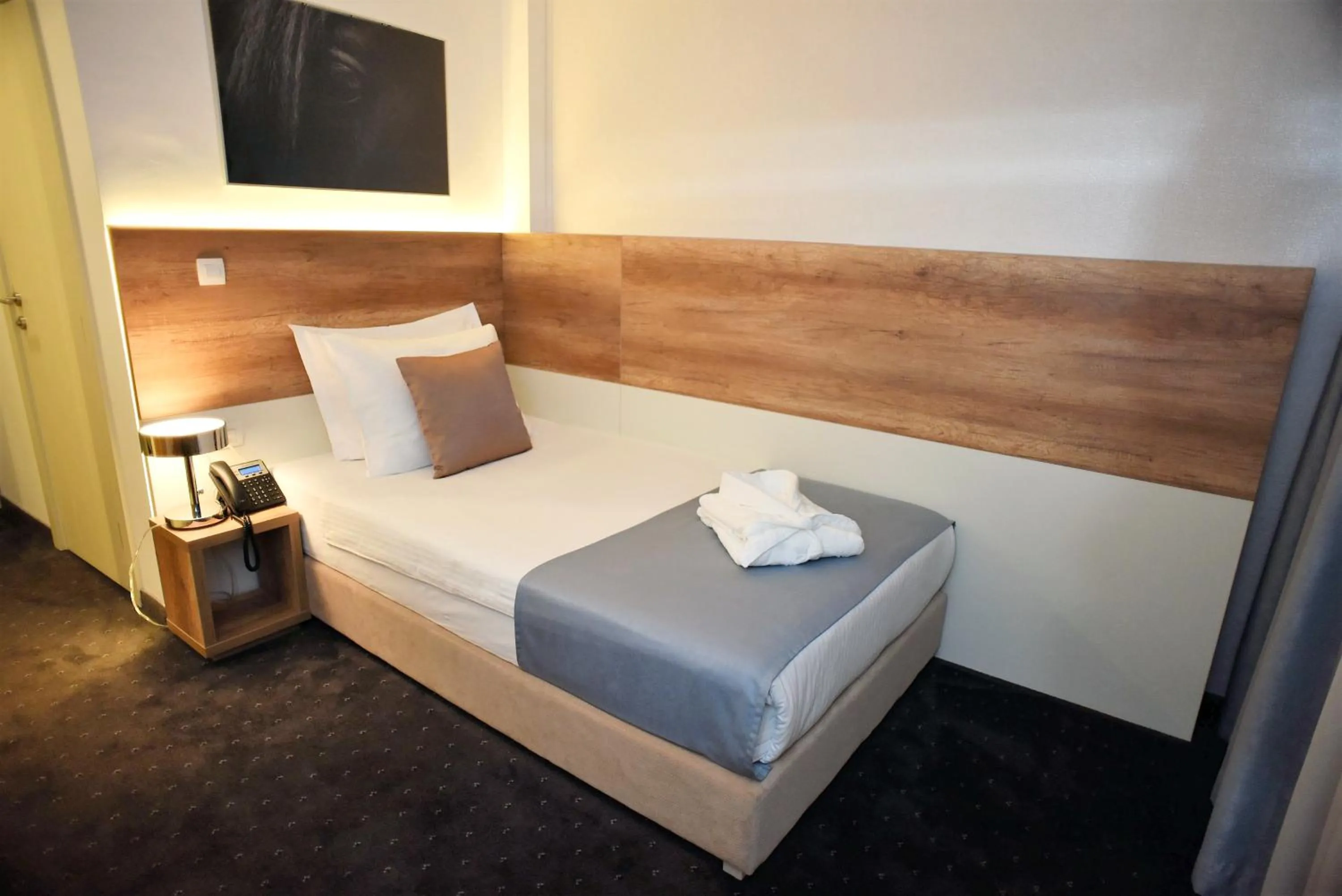 Bed in Hotel Santiny