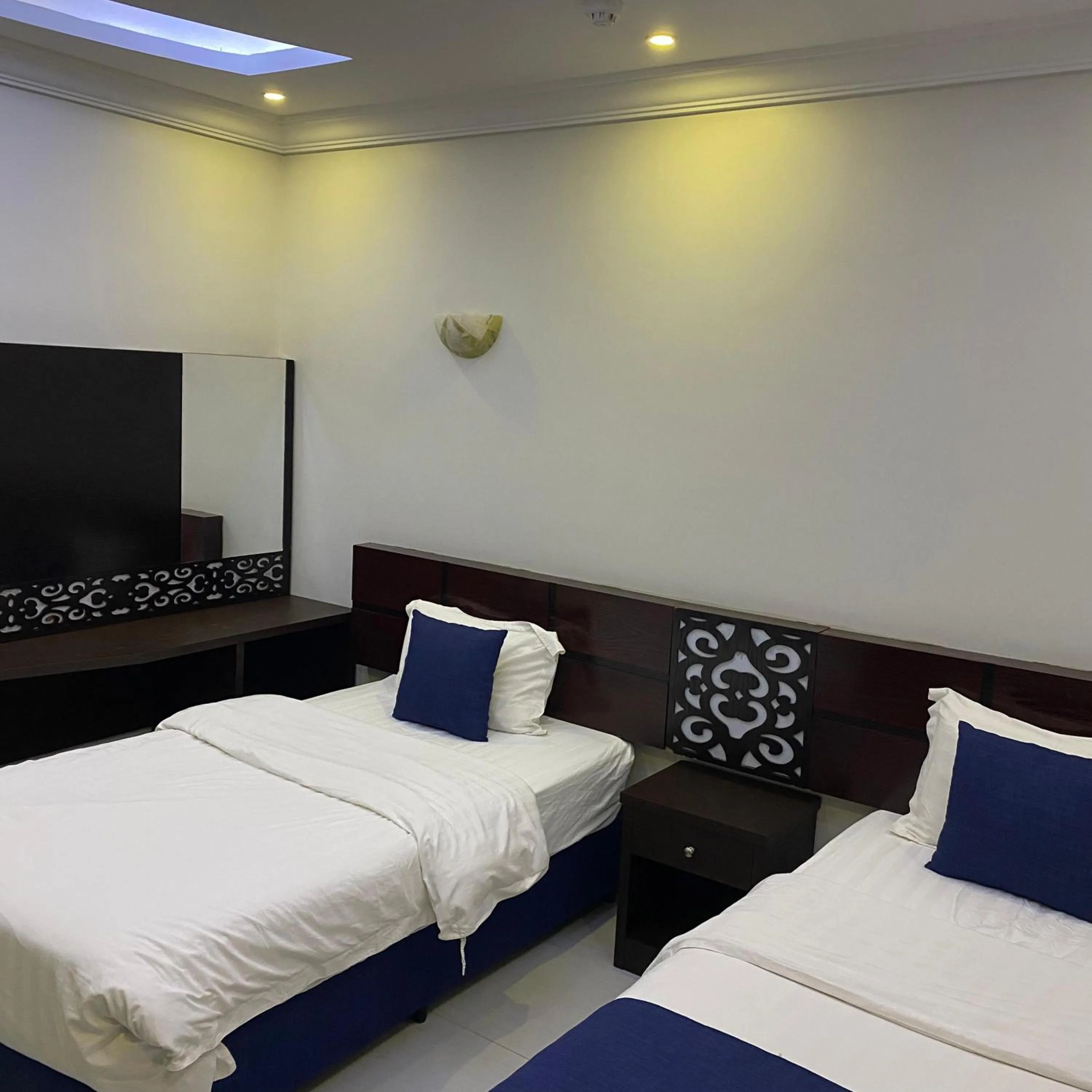 Bed in City Center Plaza Aparthotel