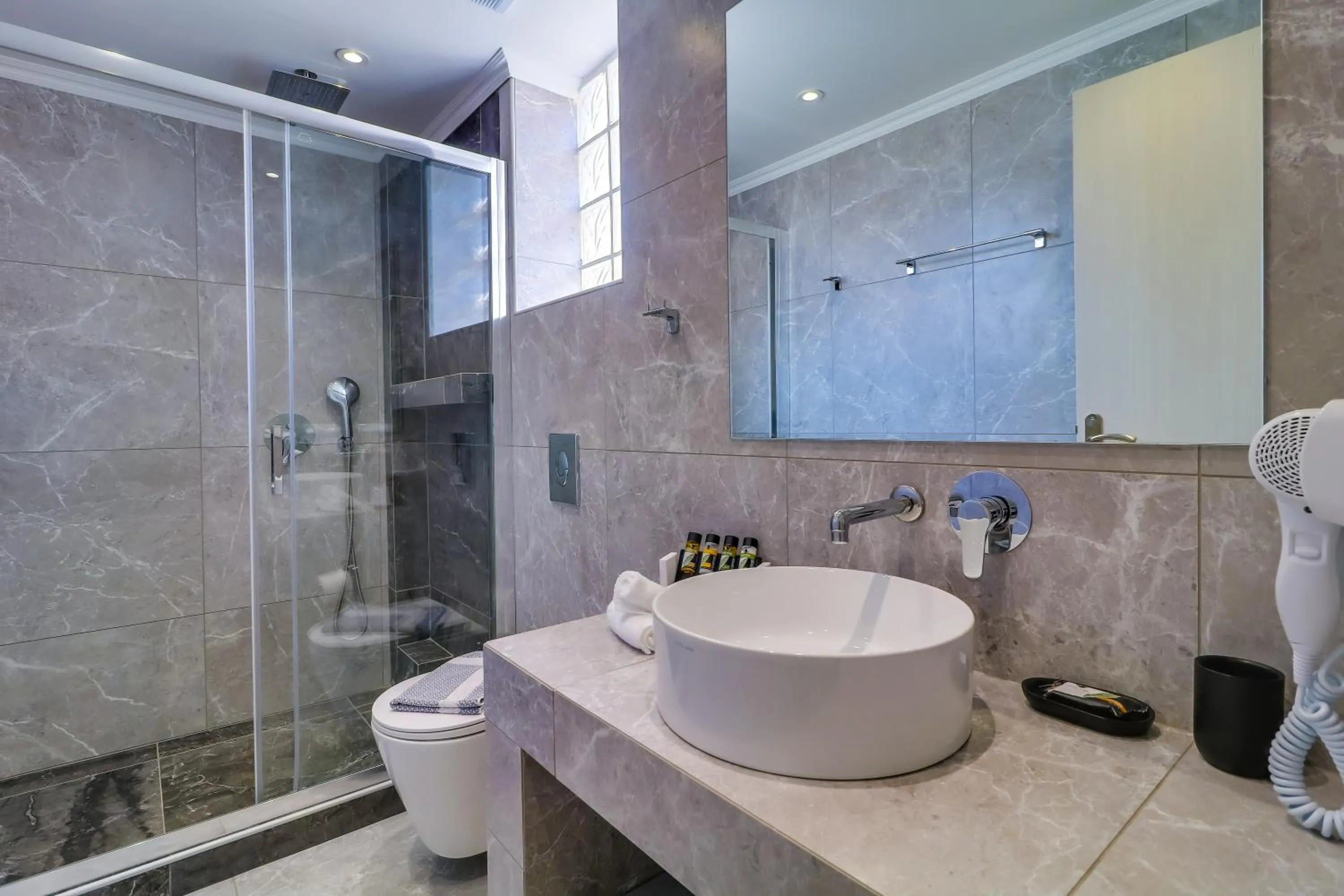 Bathroom in Theros Villas & Suites