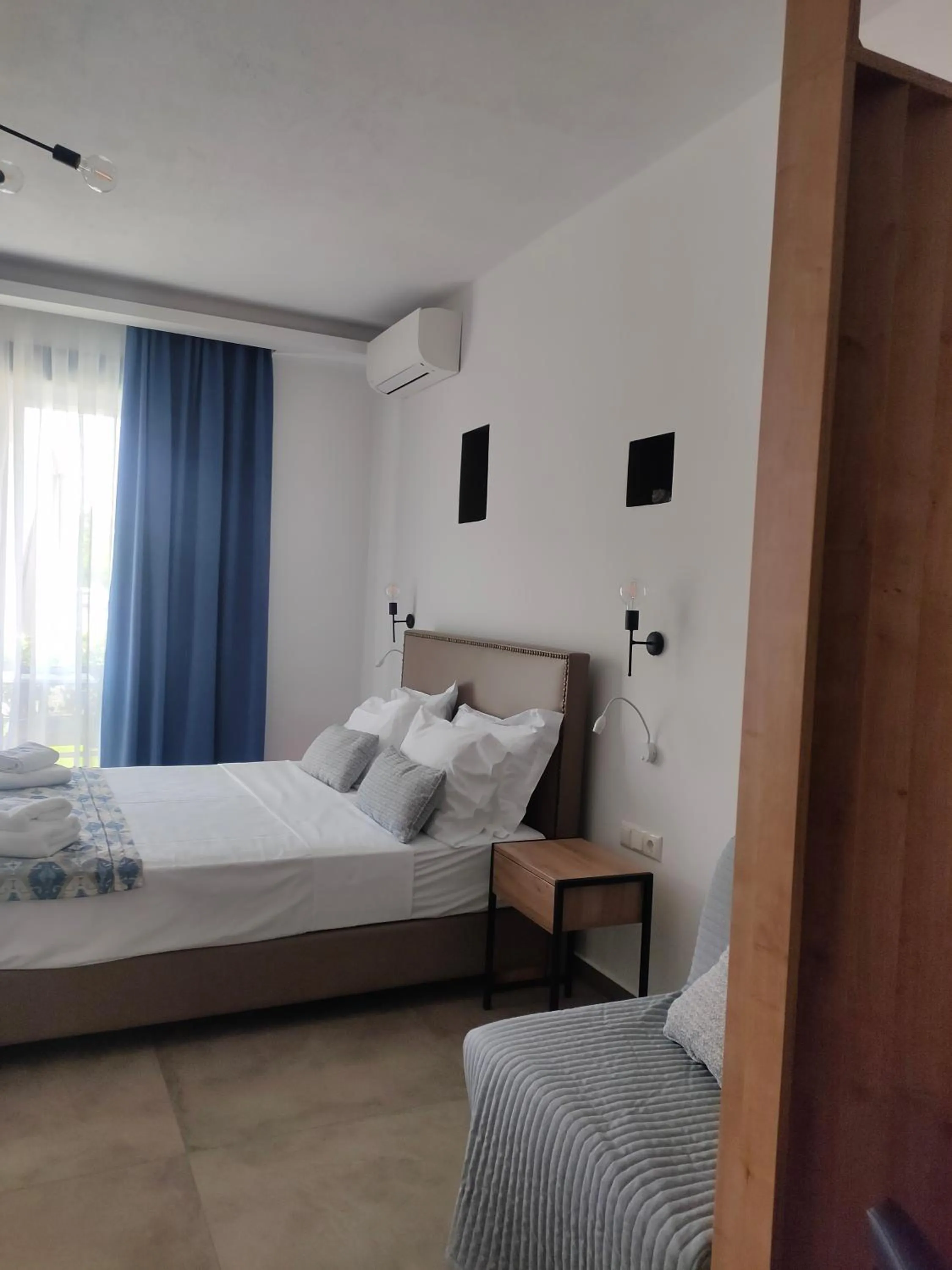 Bed in Theros Villas & Suites