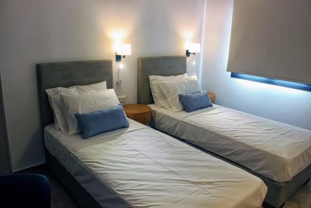 Bed in Theros Villas & Suites