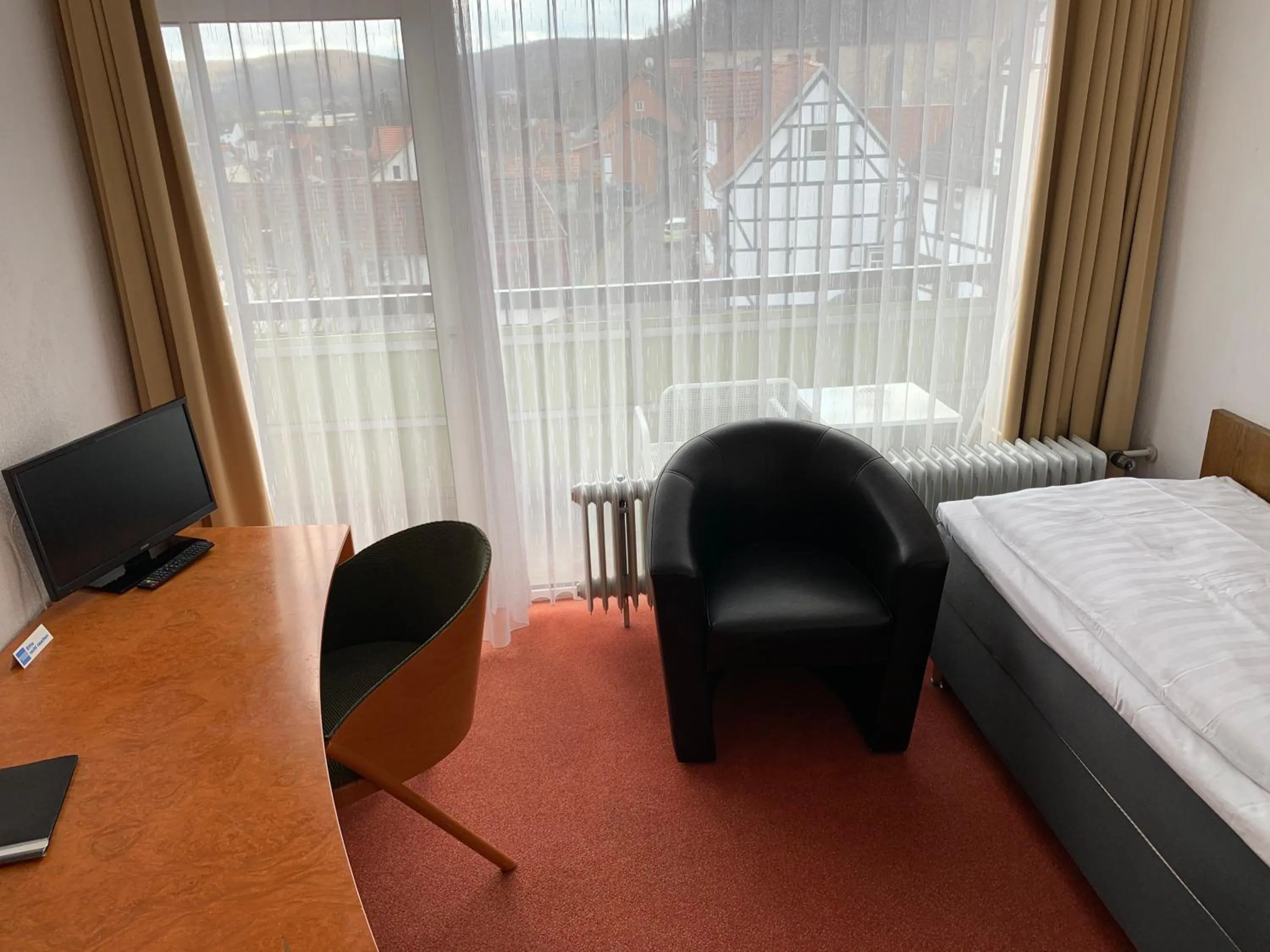 Seating area, Bed in Hotel Martina