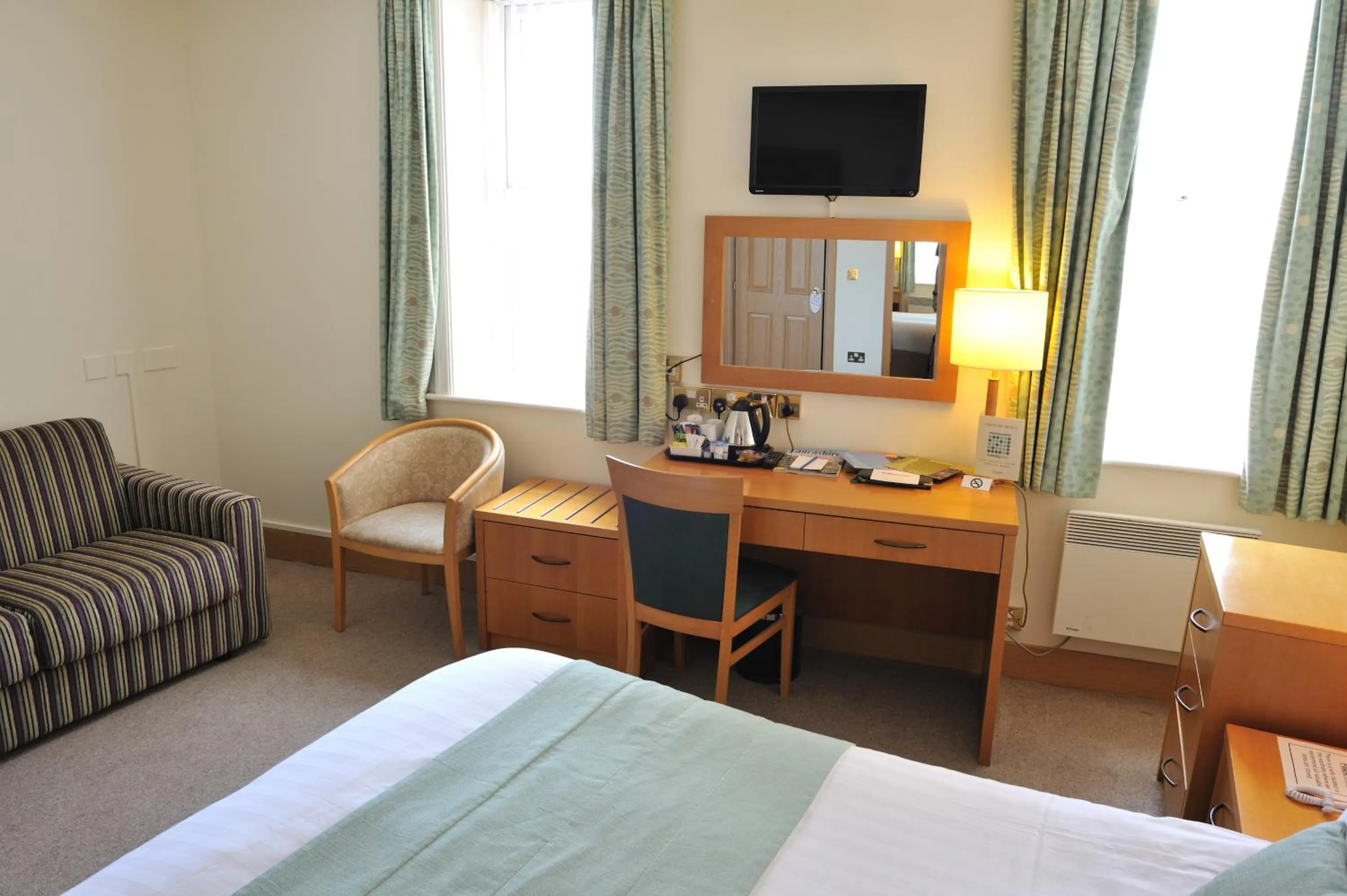 Bed in Carousel Hotel