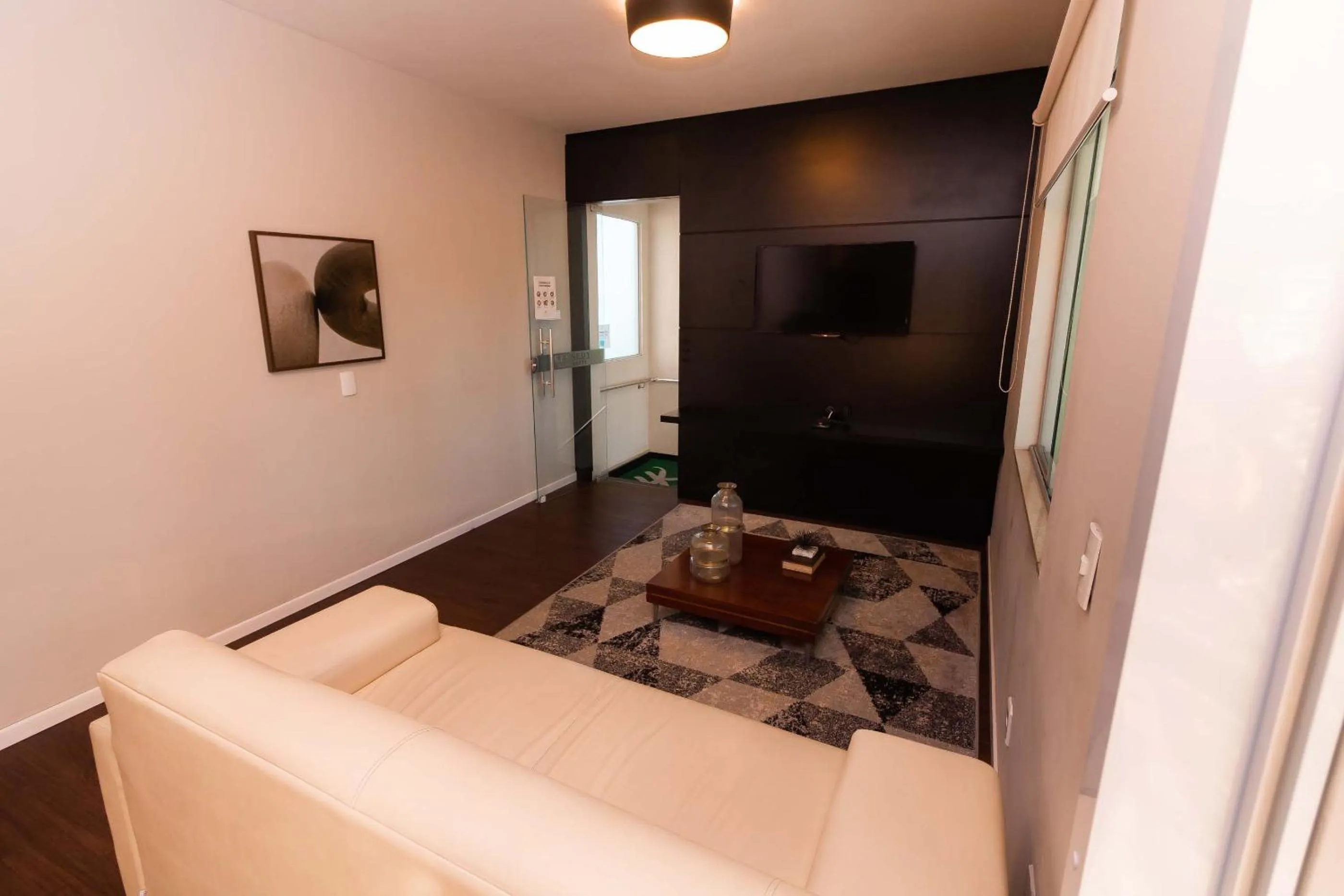 Communal lounge/ TV room in Kennedy Slim Hotel