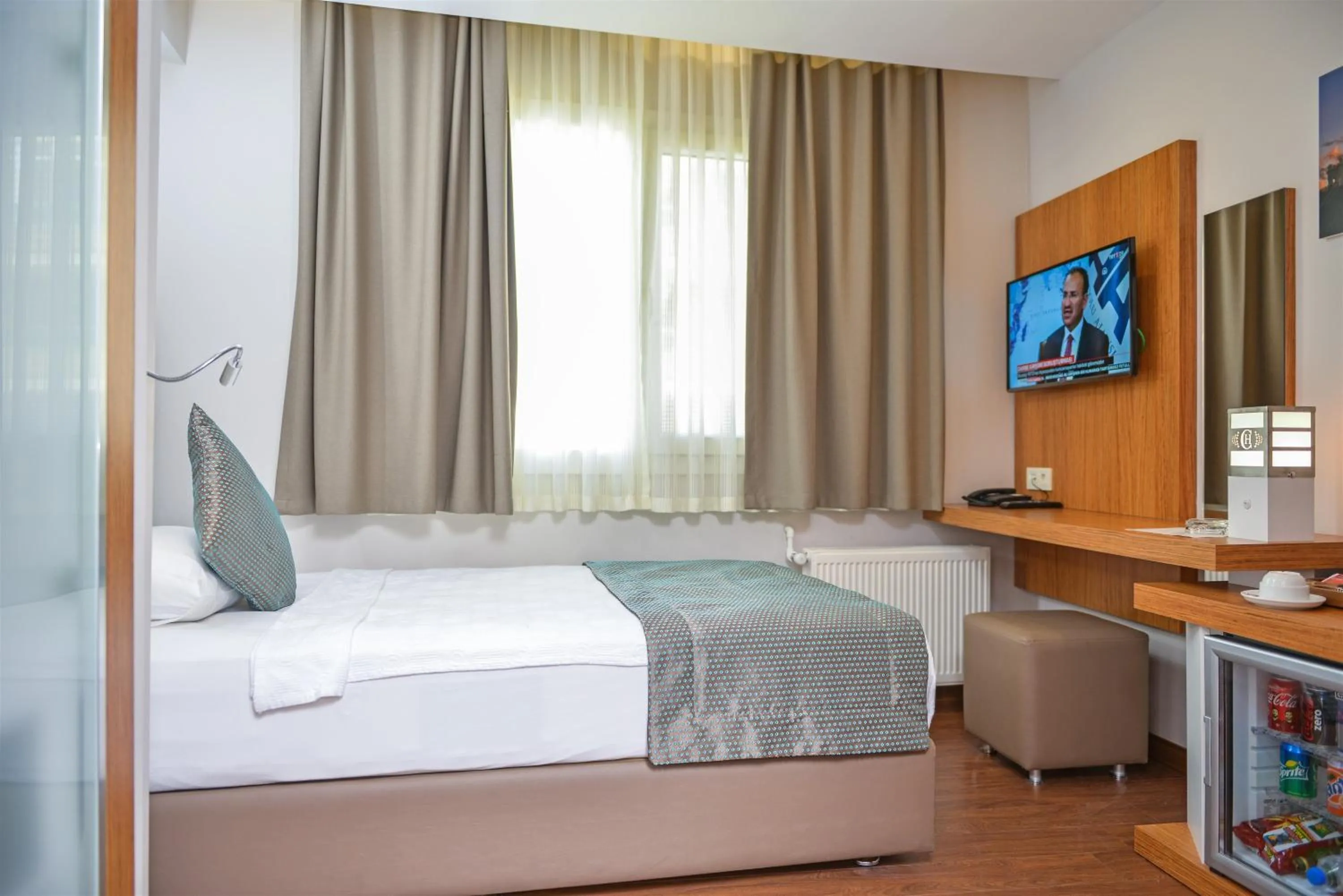 Communal lounge/ TV room, Bed in Hakcan Hotel