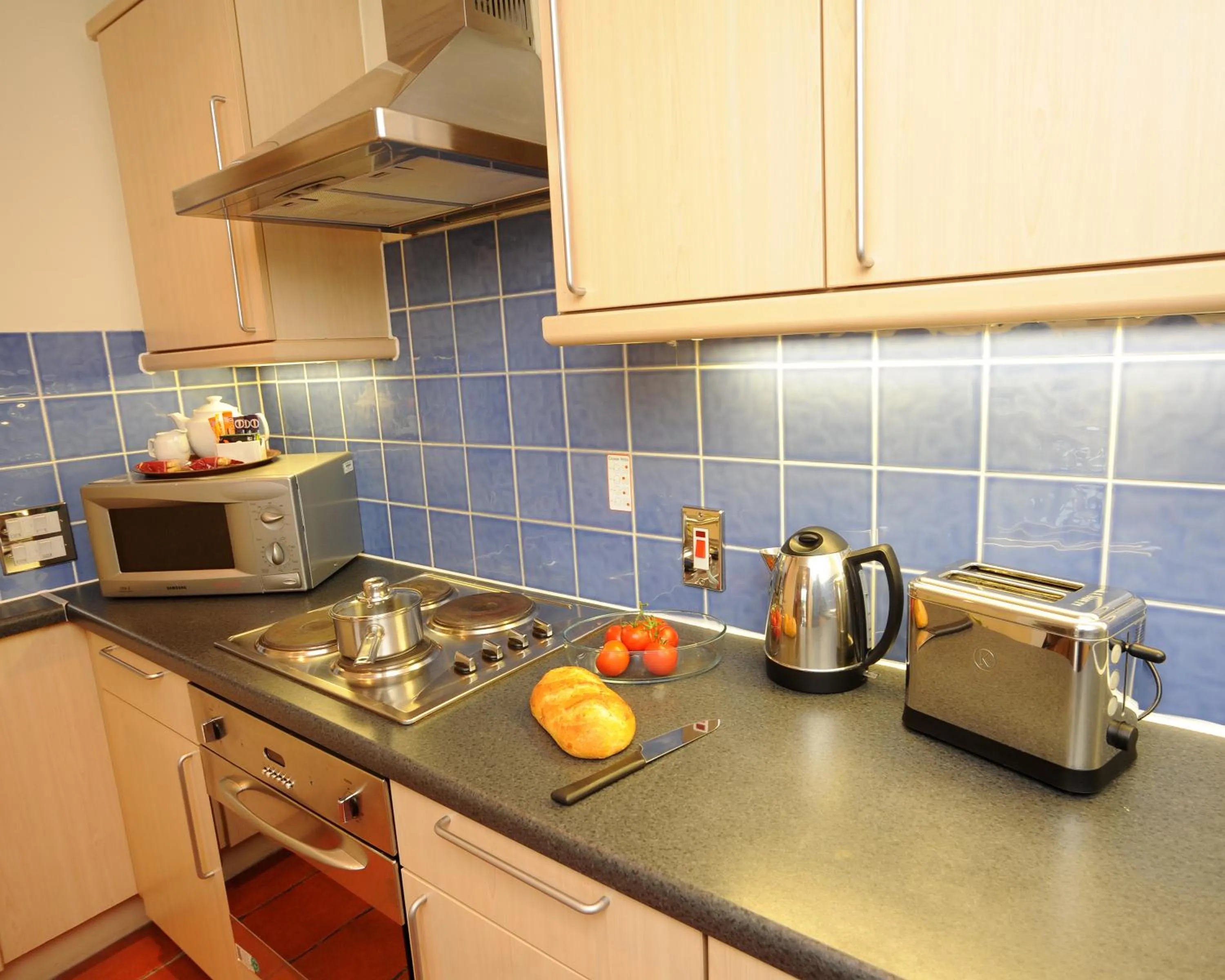 Kitchen or kitchenette in PREMIER SUITES Bristol Redcliffe