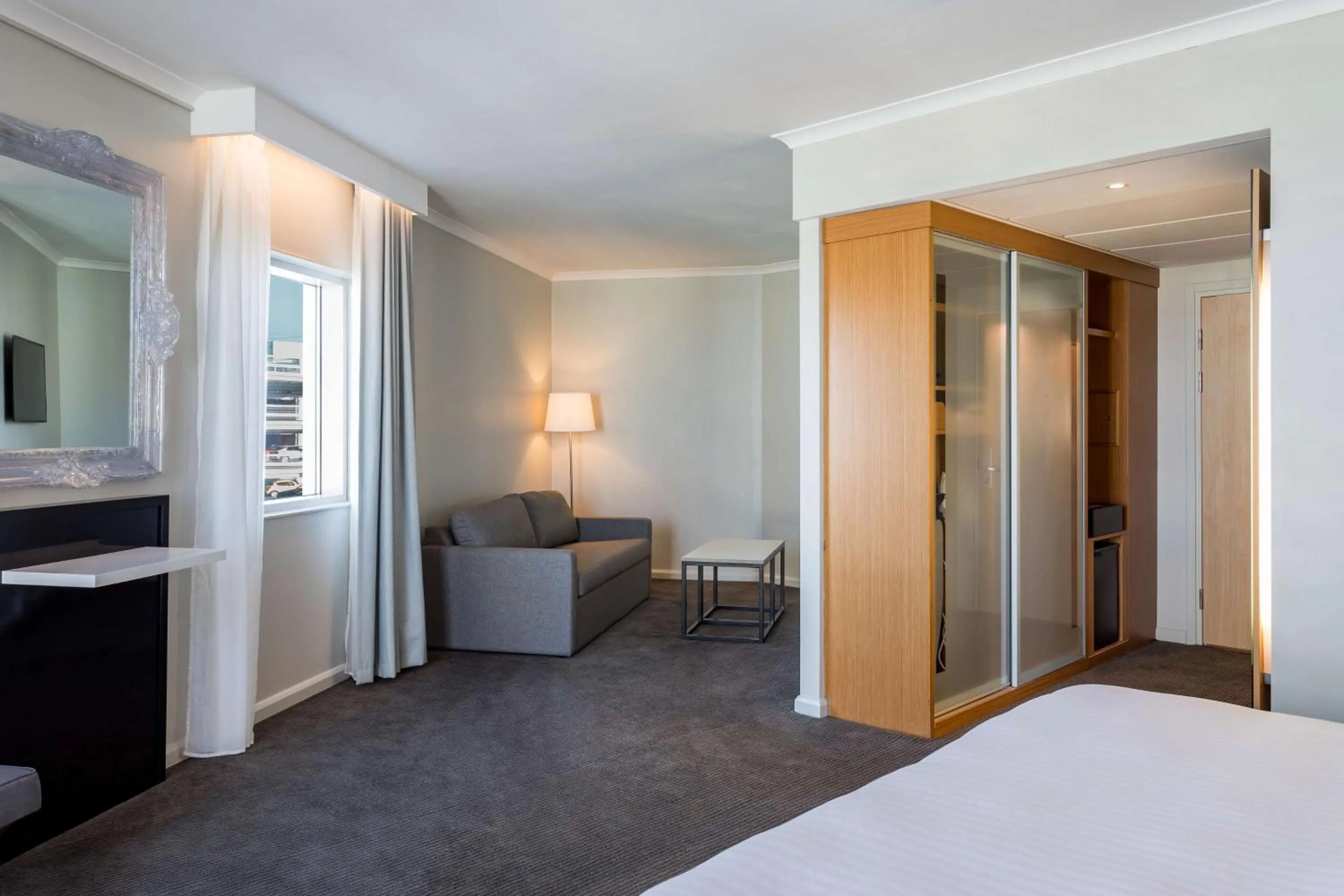 Living room, Bed in Radisson Blu Hotel London Stansted Airport