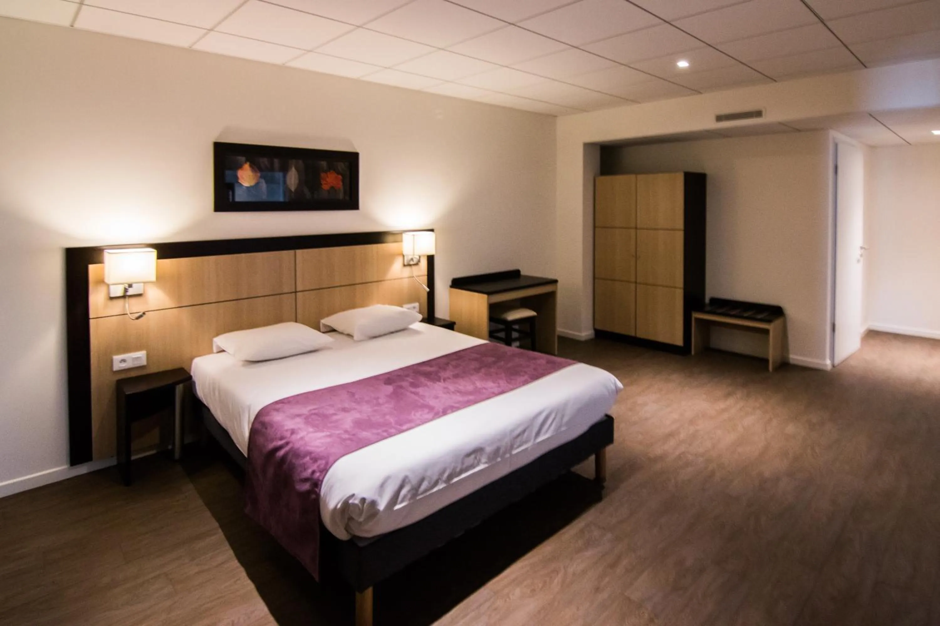 Bed in Tulip Inn Thionville Residences