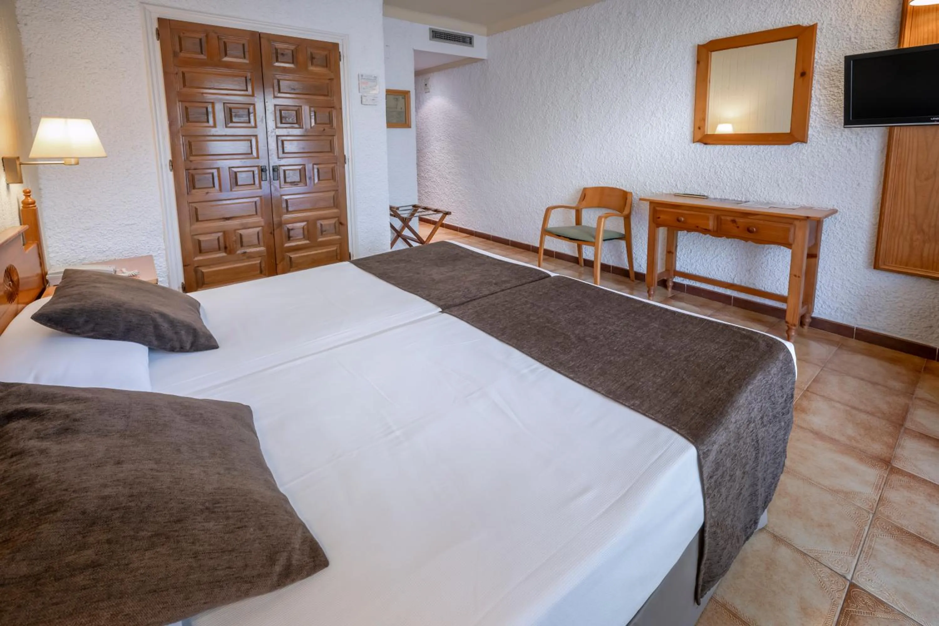 Photo of the whole room, Bed in Hotel GHT Neptuno-Tossa & Venus SPA