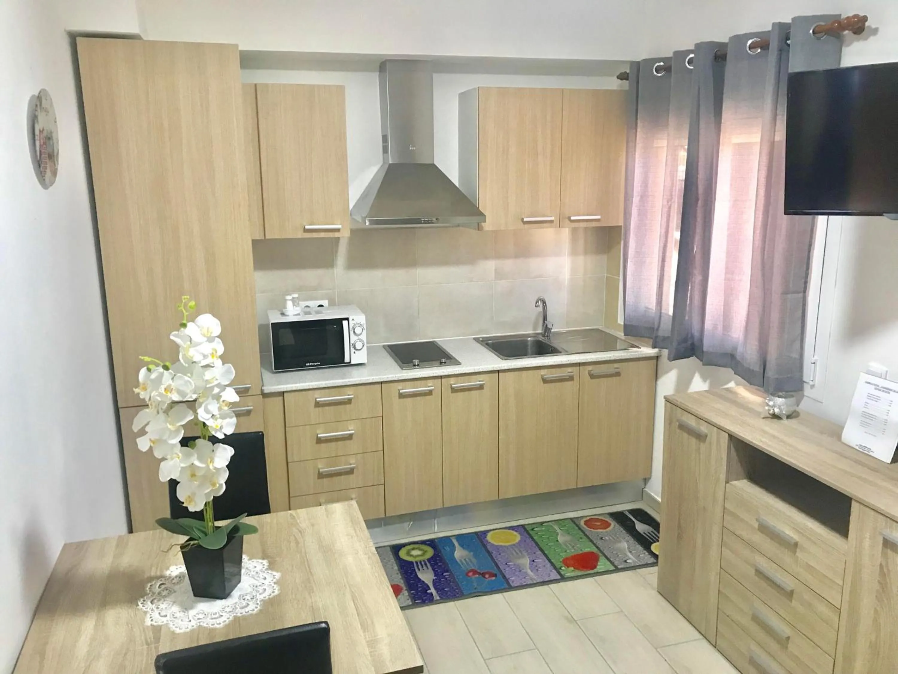 Kitchen or kitchenette in Apartamentos Giuliano