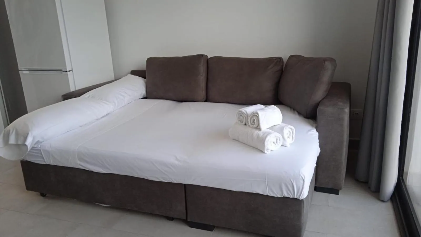 Living room, Bed in Apartamentos Giuliano