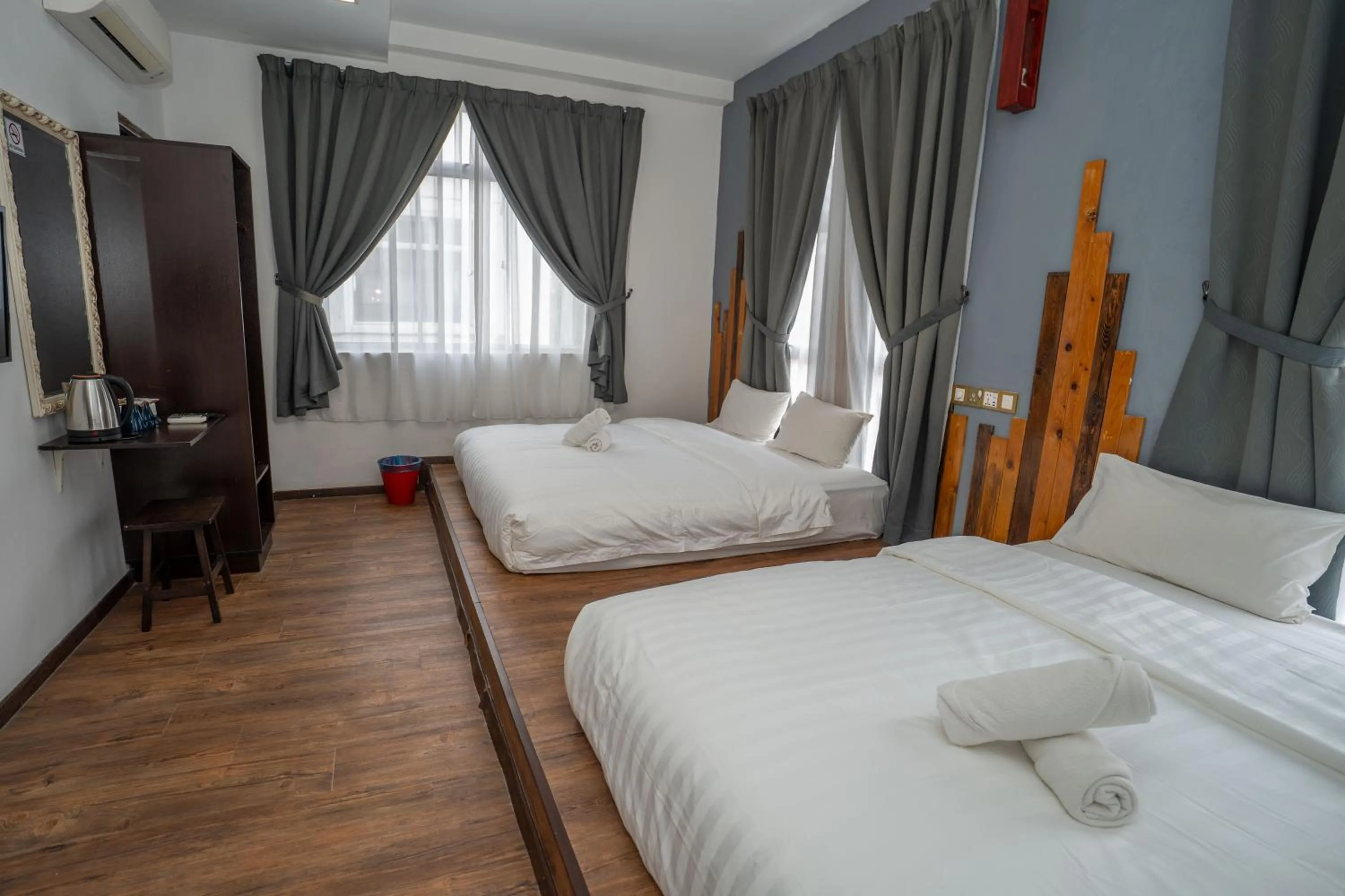 Bed in De Grand Boutique Hotel