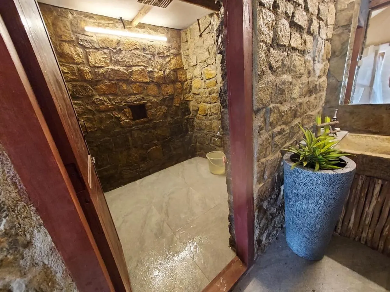Bathroom in Deshadan Eco Valley Resort - An Eco friendly Mud House