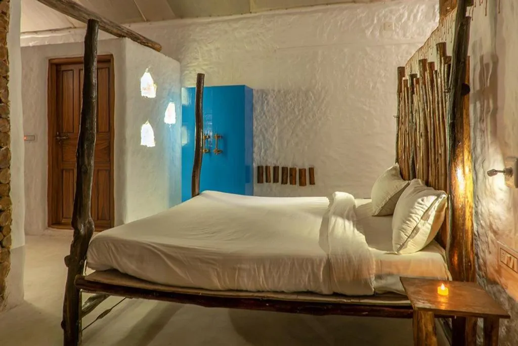 Bed in Deshadan Eco Valley Resort - An Eco friendly Mud House