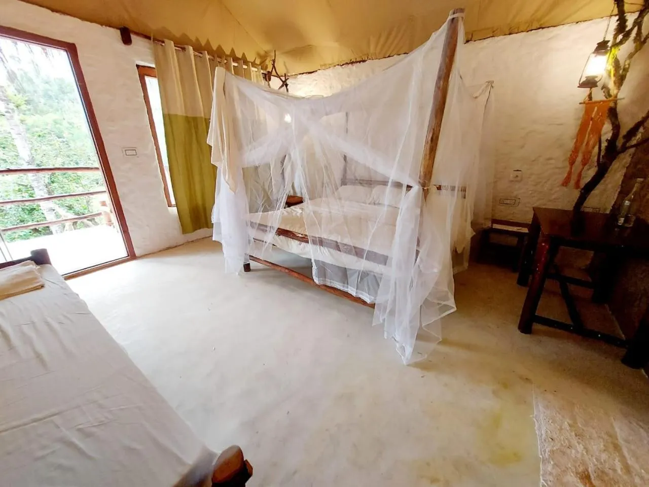 Bed in Deshadan Eco Valley Resort - An Eco friendly Mud House