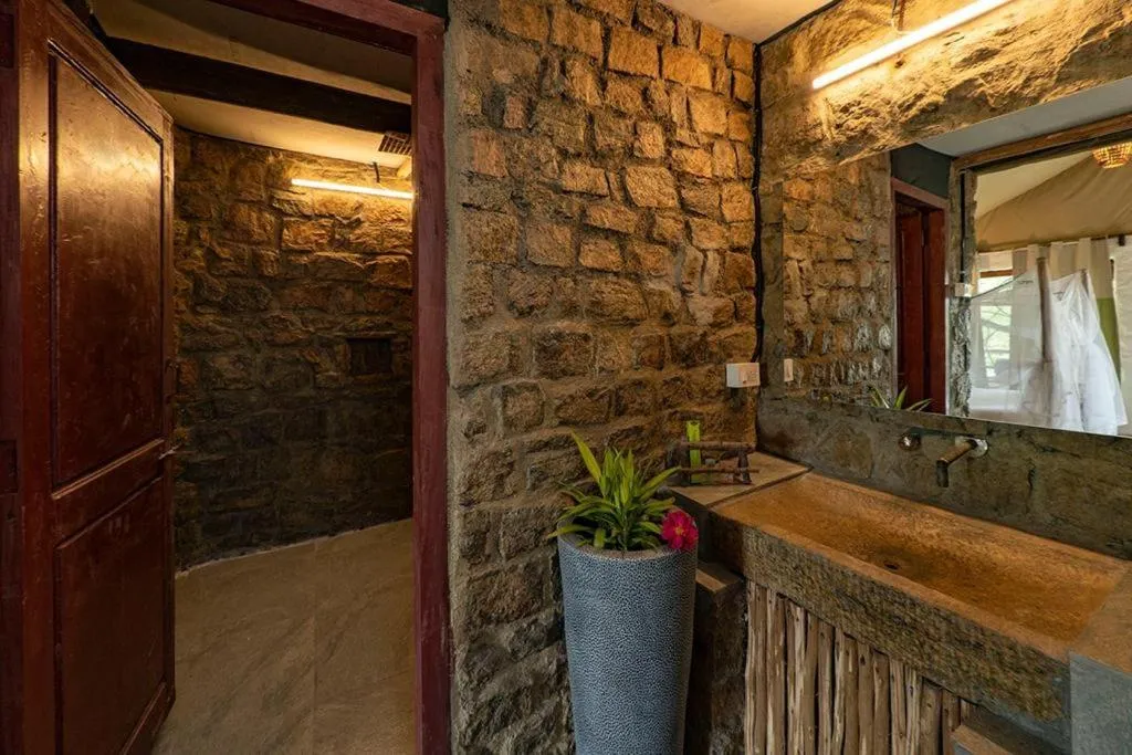 Bathroom in Deshadan Eco Valley Resort - An Eco friendly Mud House