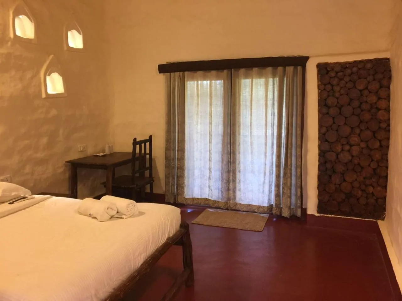 Photo of the whole room, Bed in Deshadan Eco Valley Resort - An Eco friendly Mud House