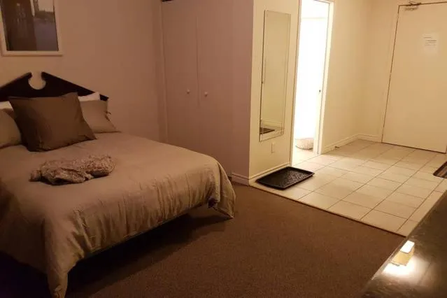 Bed in Cozy Little Studio #16 by Amazing Property Rentals