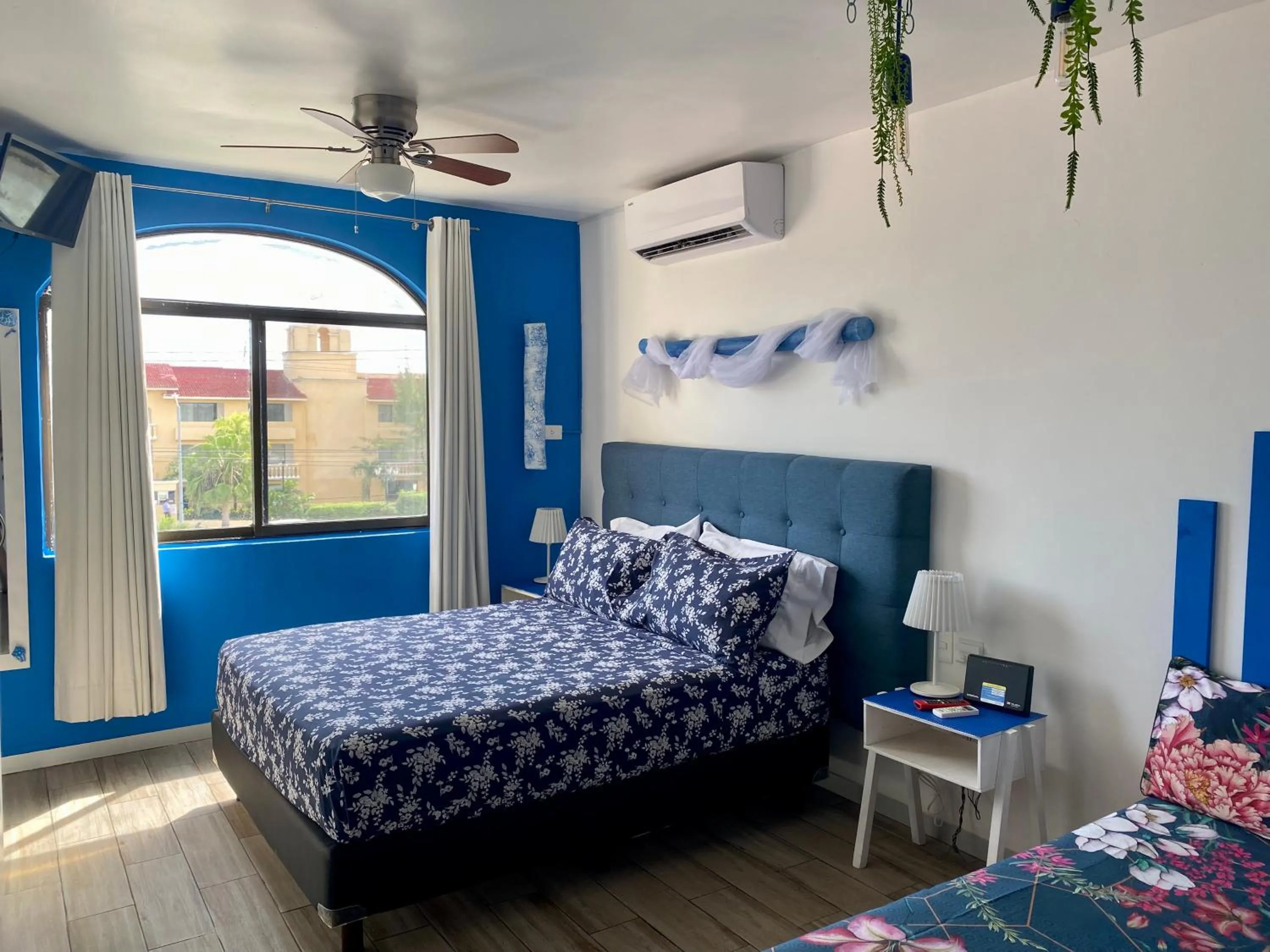 Bed in Tropical apartment