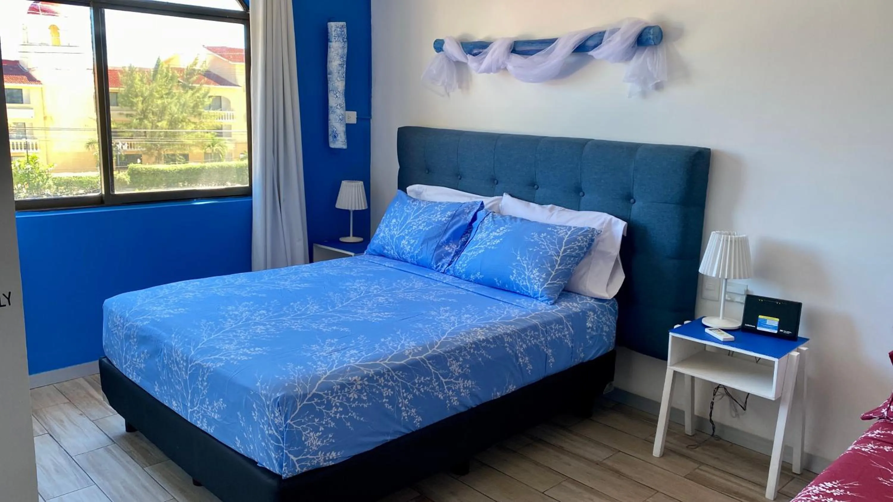 Bed in Tropical apartment