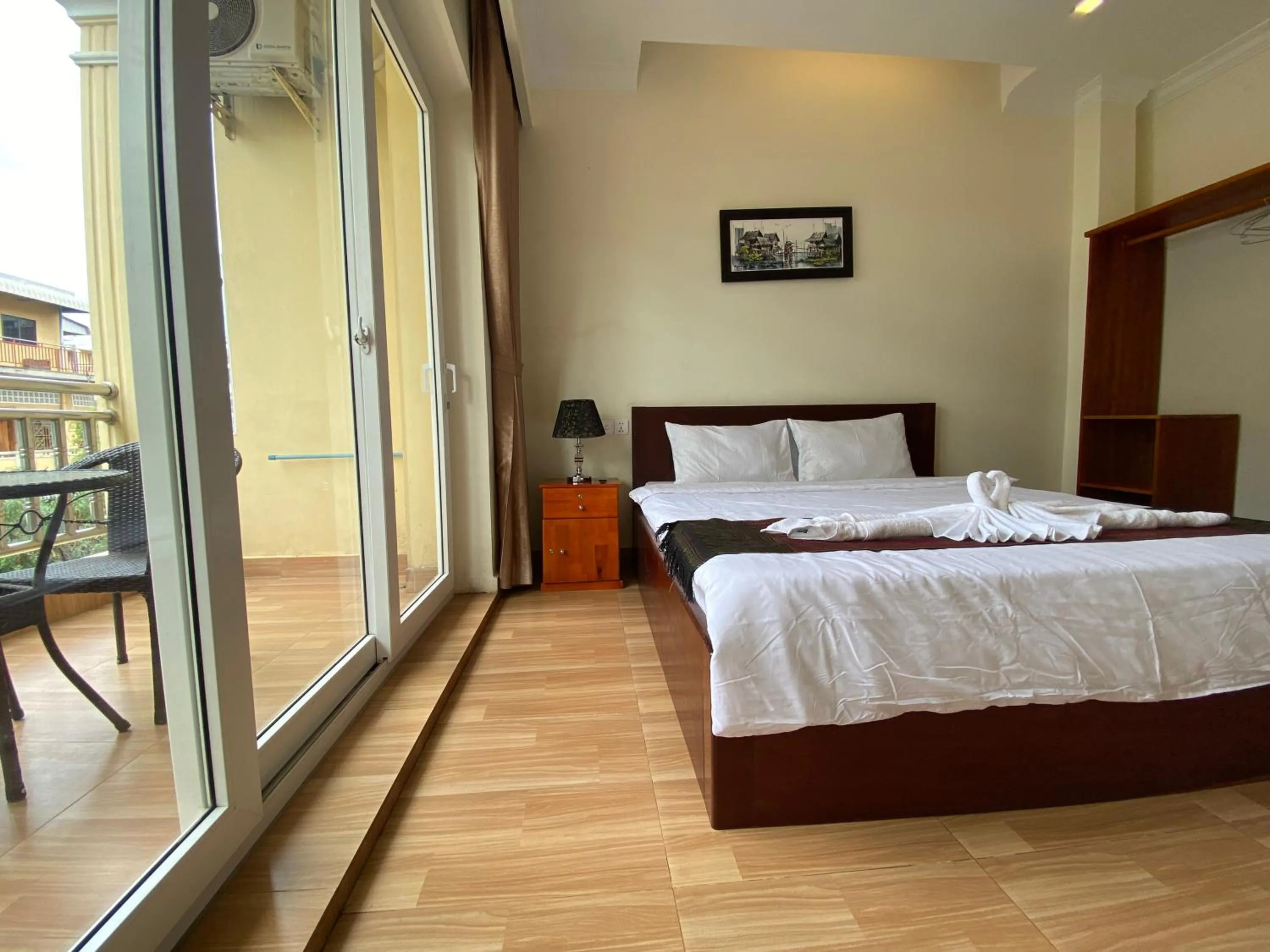 Photo of the whole room, Bed in Phnom Penh Le Vincent Hotel