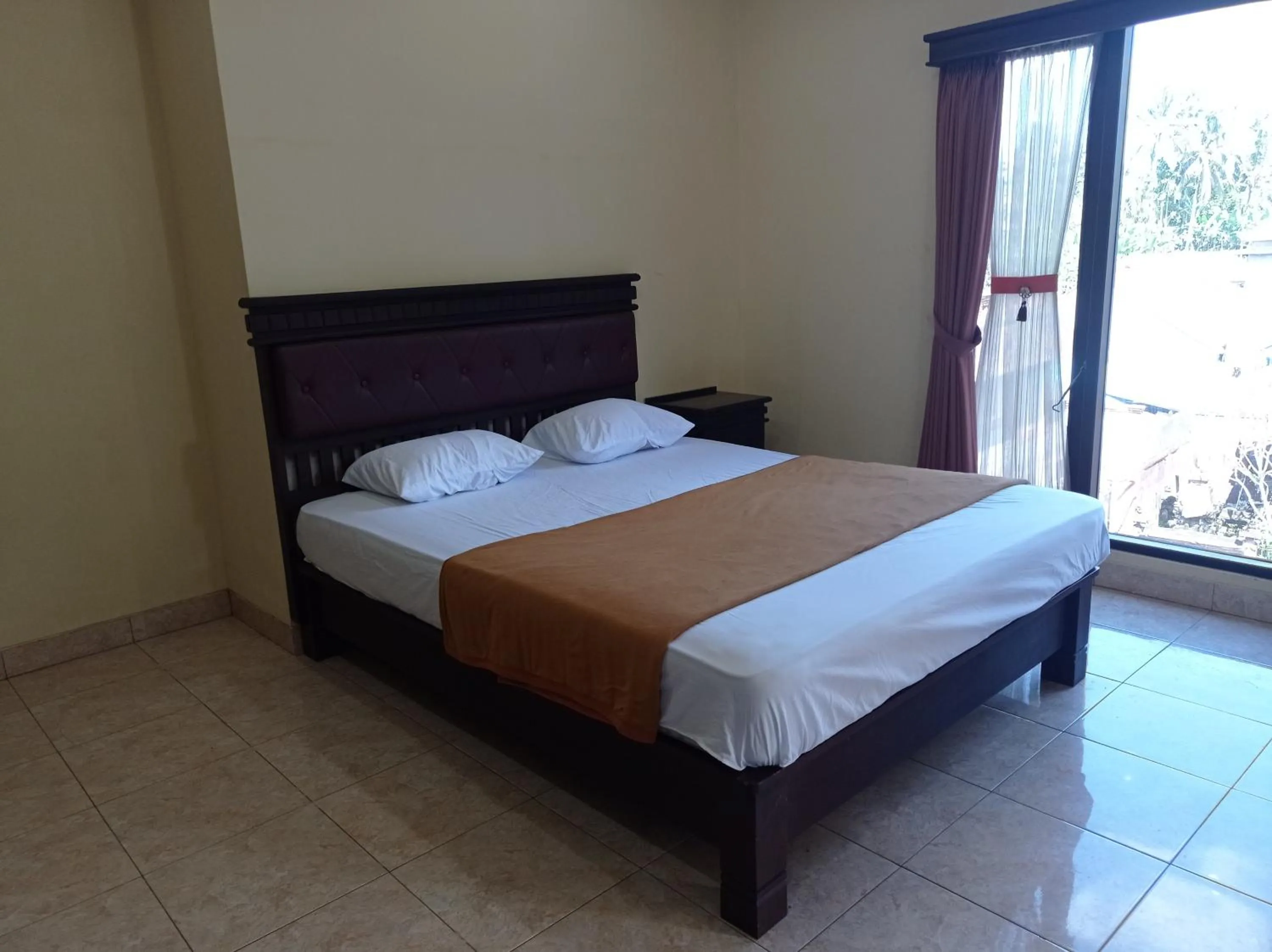 Bed in Hotel Mawar Sari Mitra RedDoorz
