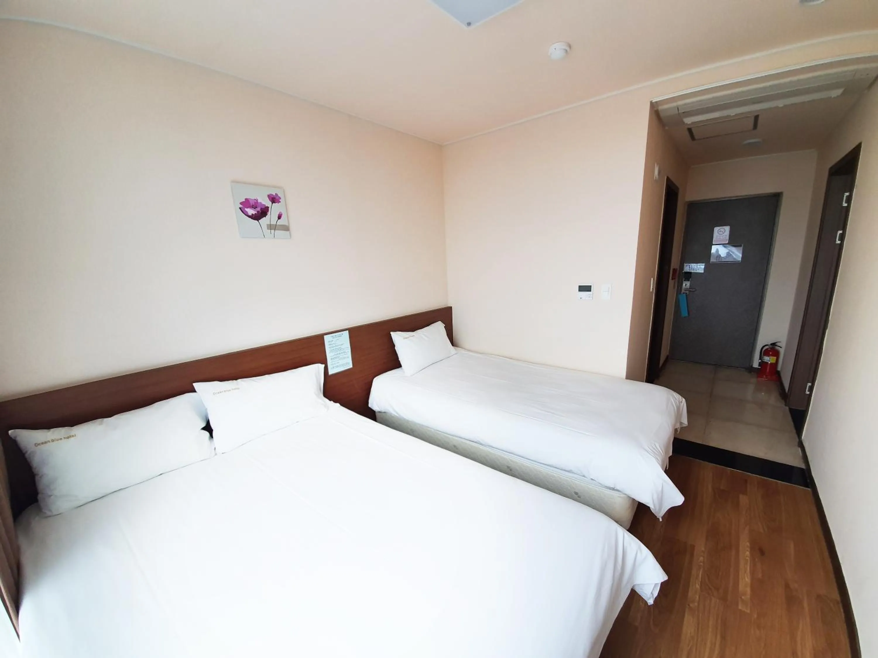 Bed in Jeju Jungmun Ocean Blue Hotel