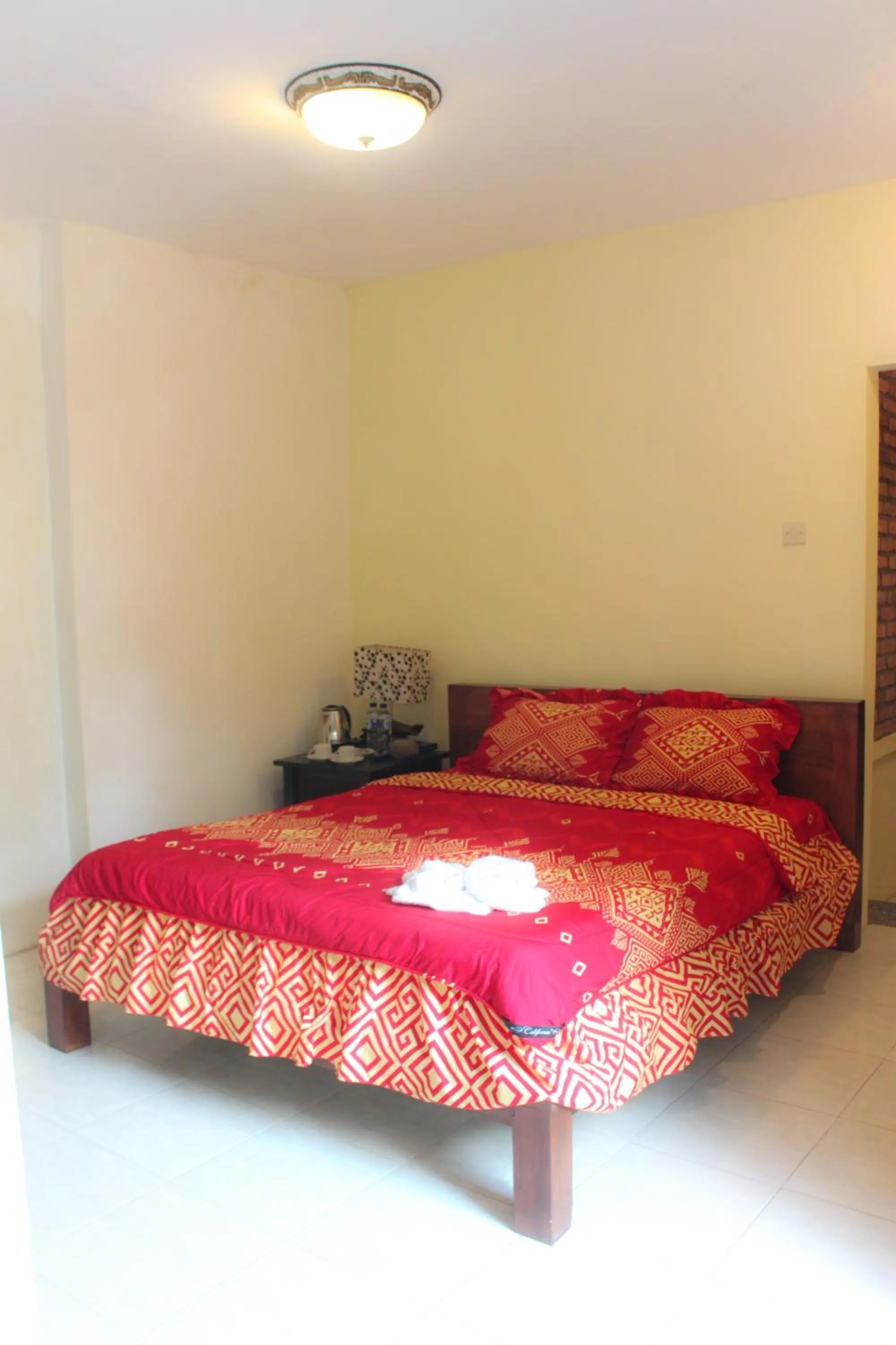Bed in Griya Gribig Guest House Mitra RedDoorz