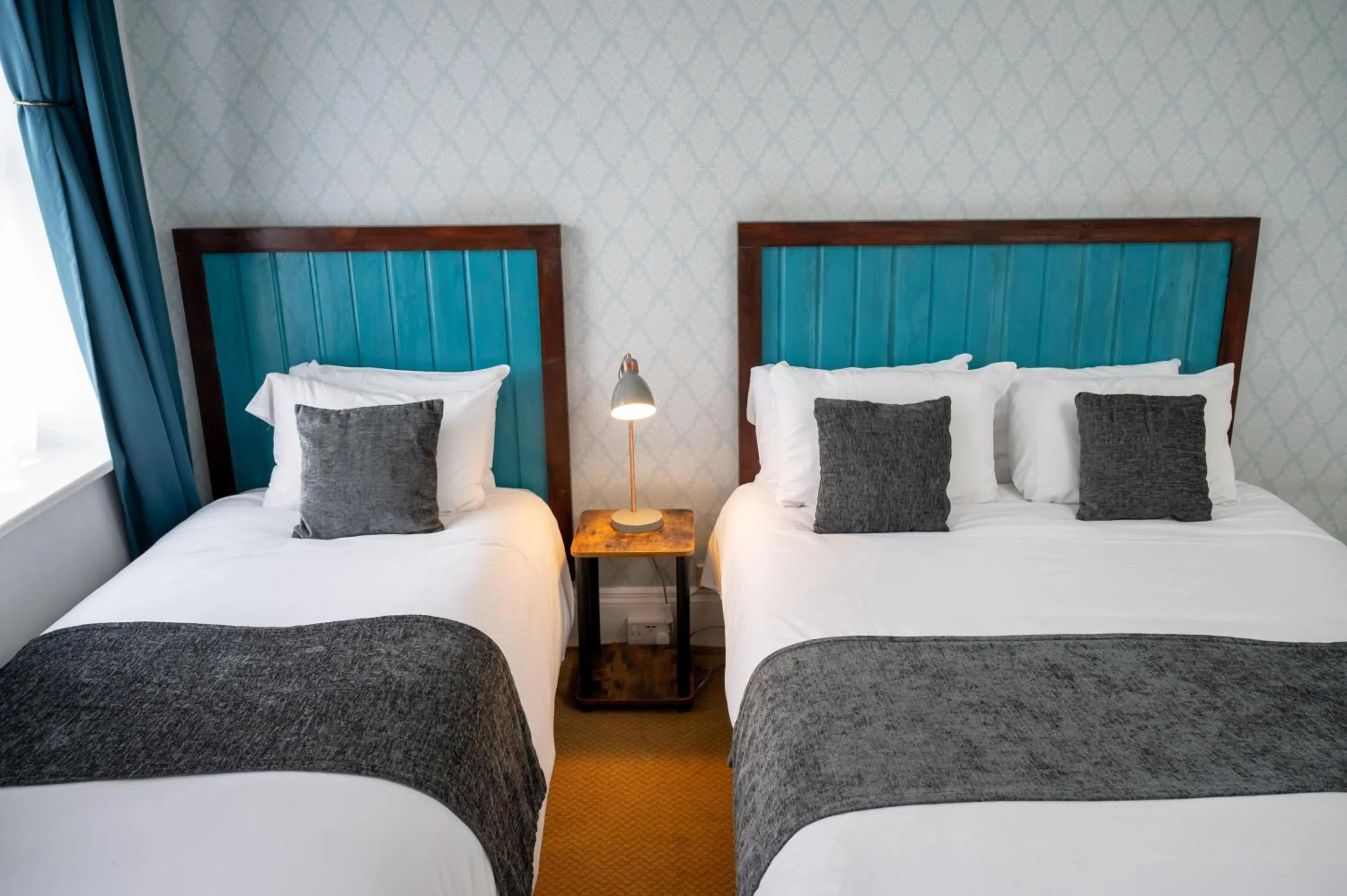 Bed in Rising Sun Hotel by Greene King Inns