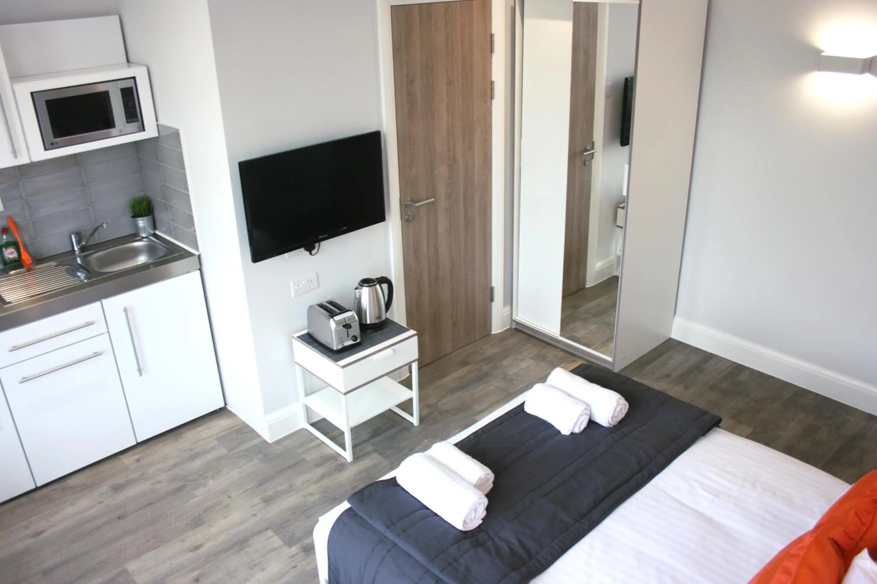 Bed in Westciti Caroco Aparthotel