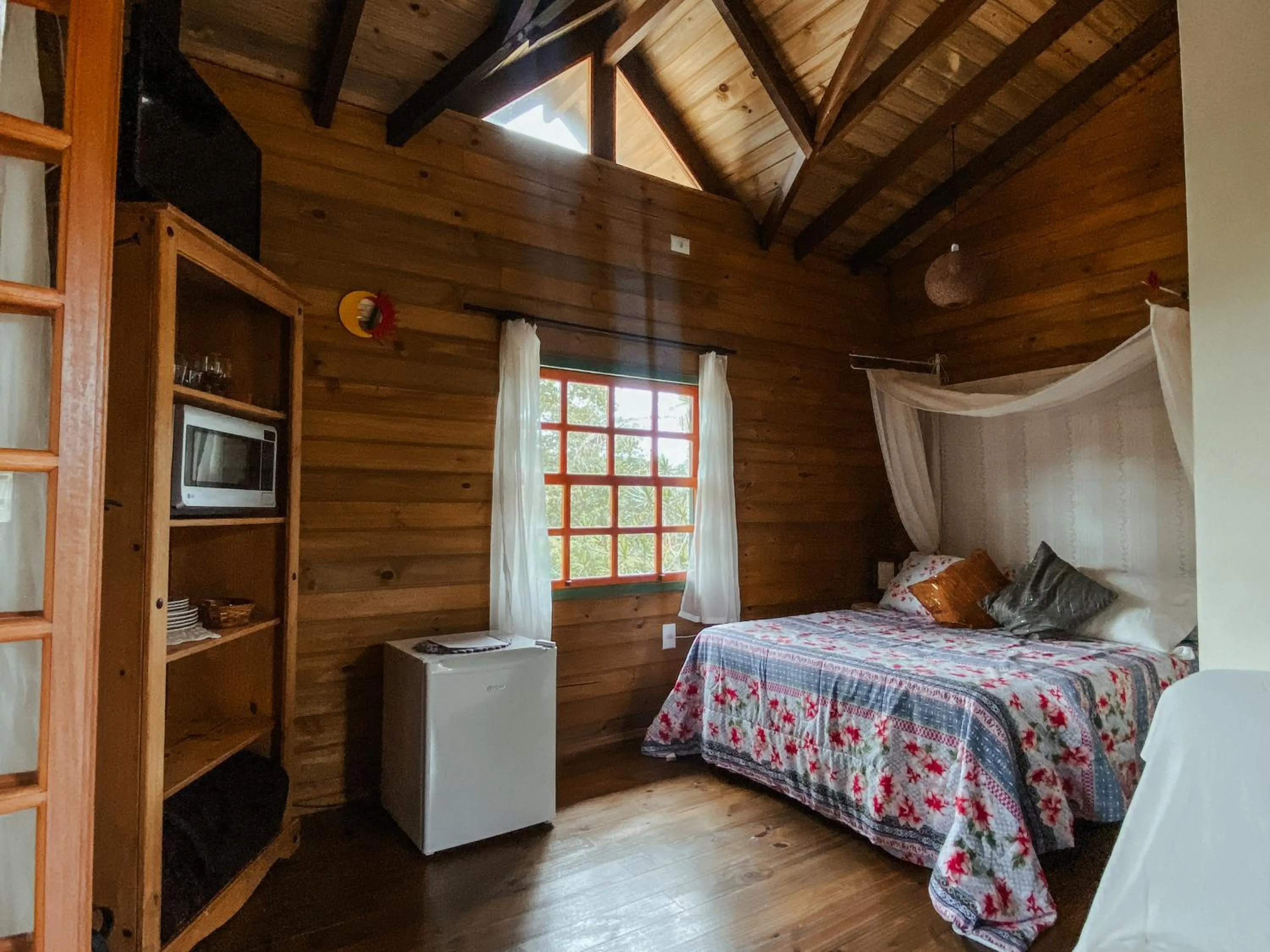 Bed in Pousada Refúgio dos Pássaros