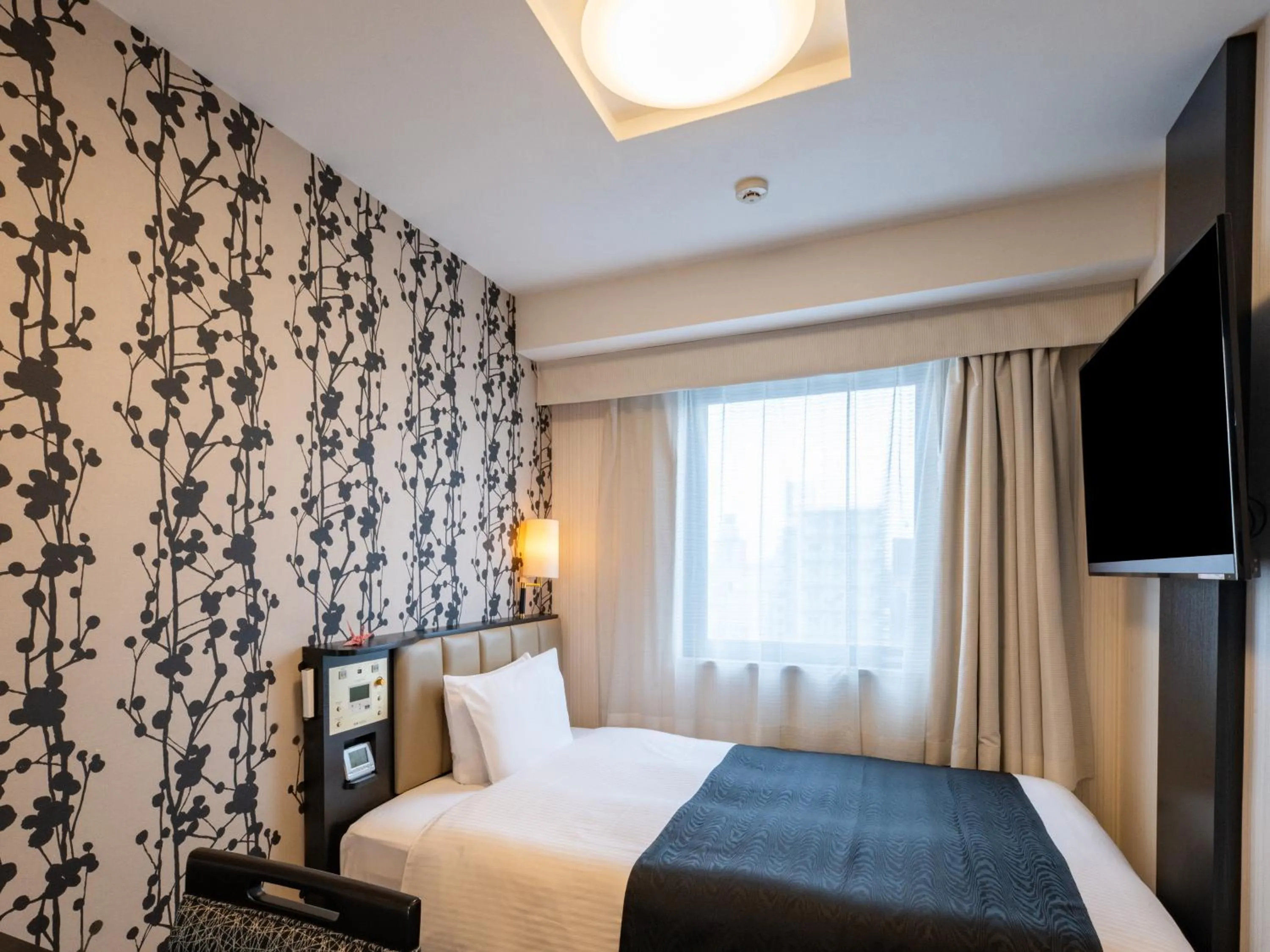 Bed in APA Hotel Nagoya Sakae Higashi