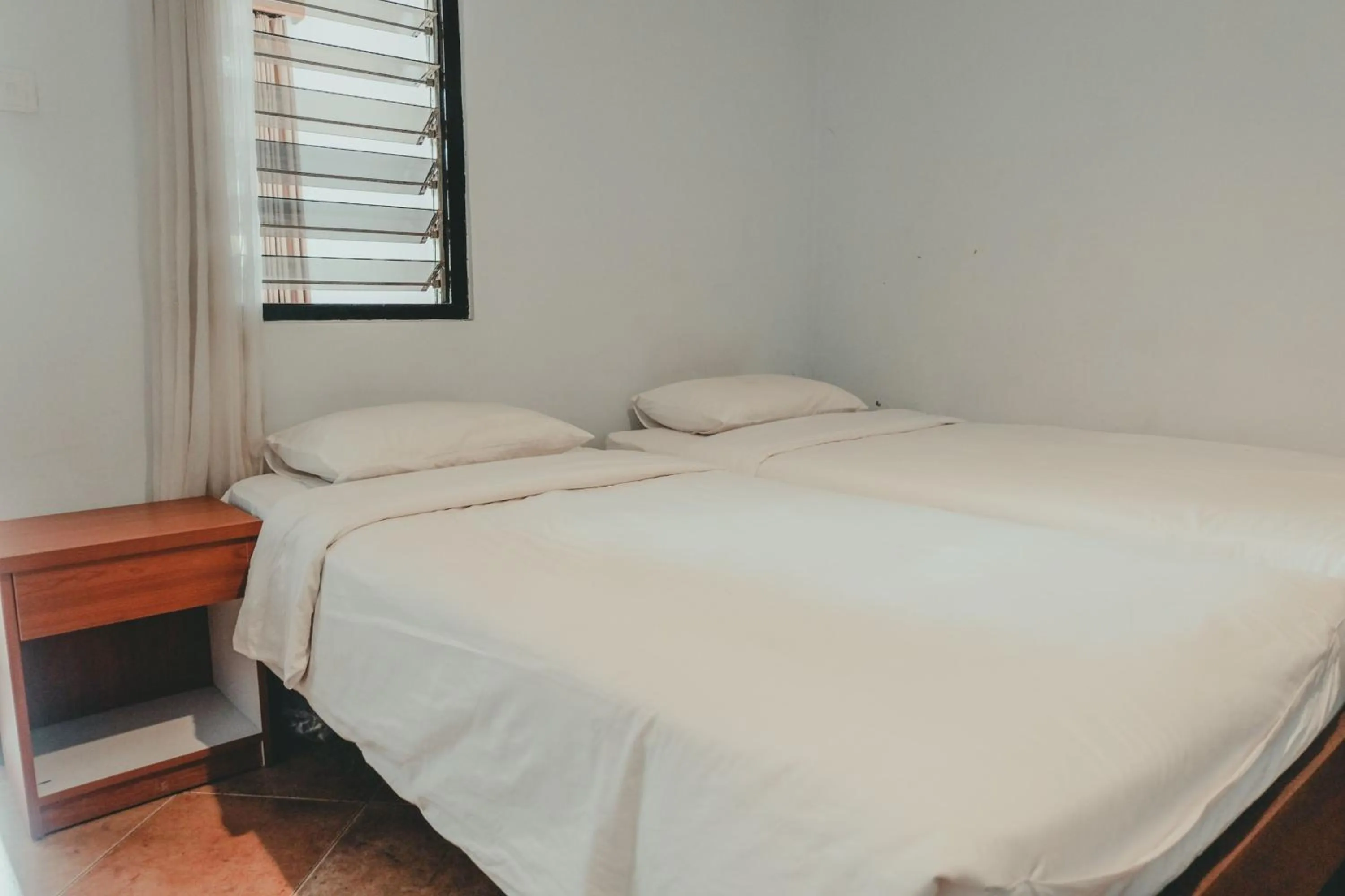 Photo of the whole room, Bed in Sekar Arum Riverside Resort in Canggu