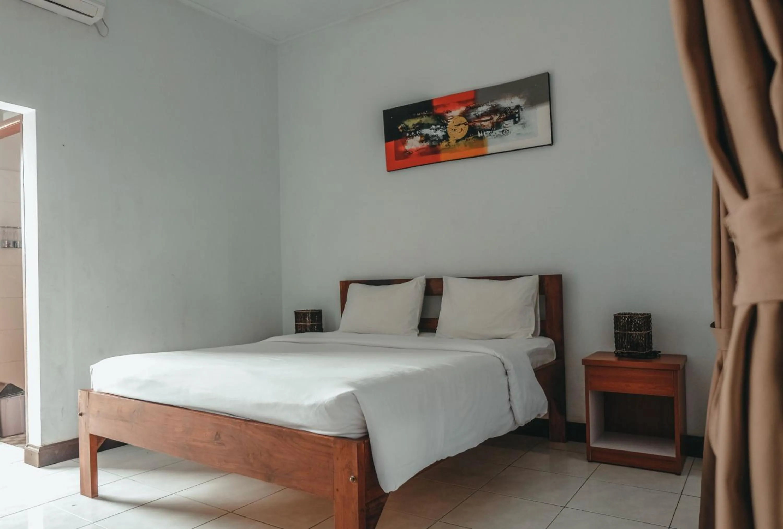 Photo of the whole room, Bed in Sekar Arum Riverside Resort in Canggu