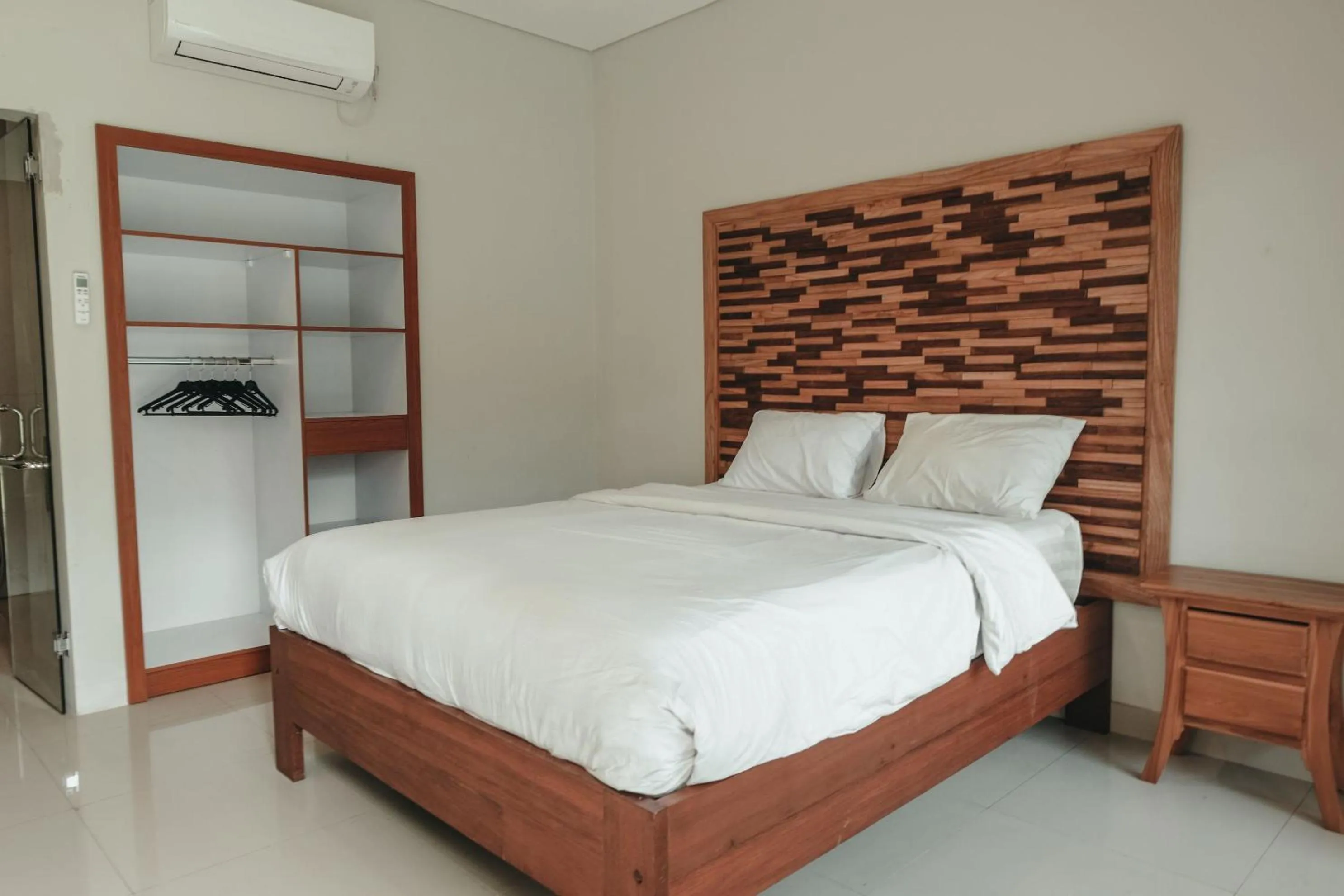 Photo of the whole room, Bed in Sekar Arum Riverside Resort in Canggu