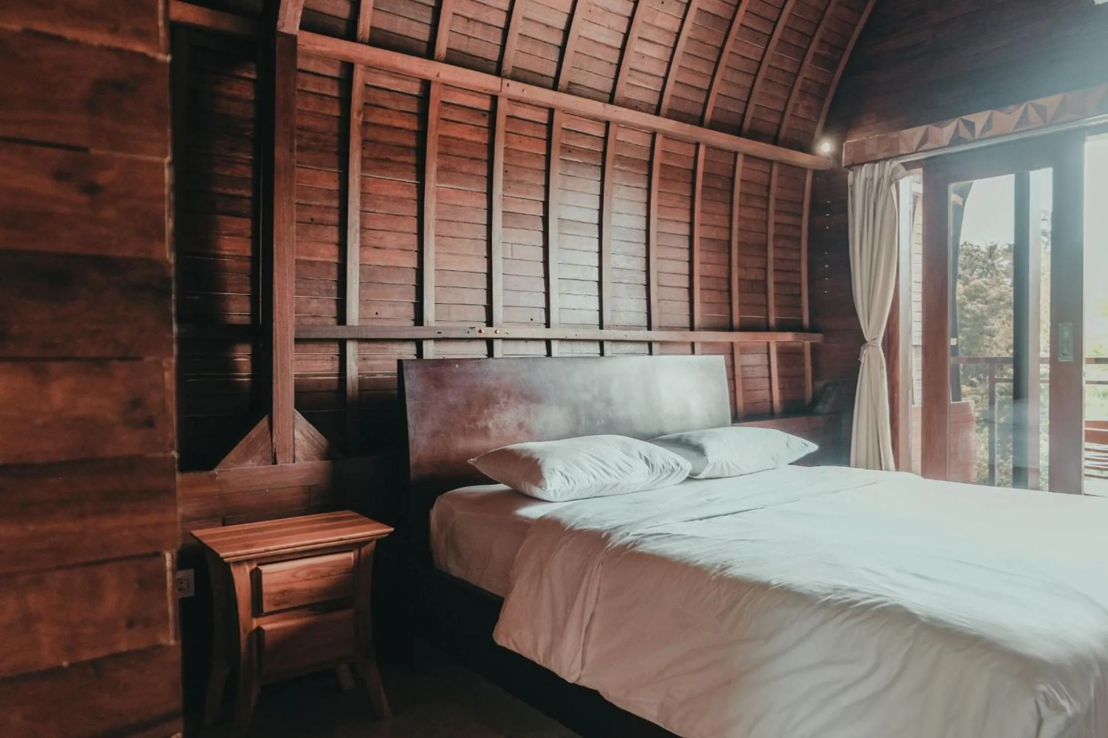 Photo of the whole room, Bed in Sekar Arum Riverside Resort in Canggu