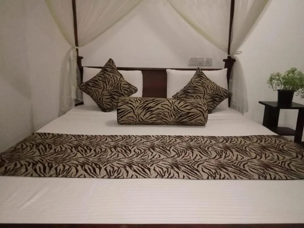 Bed in Sigiriya Rock Gate Resort