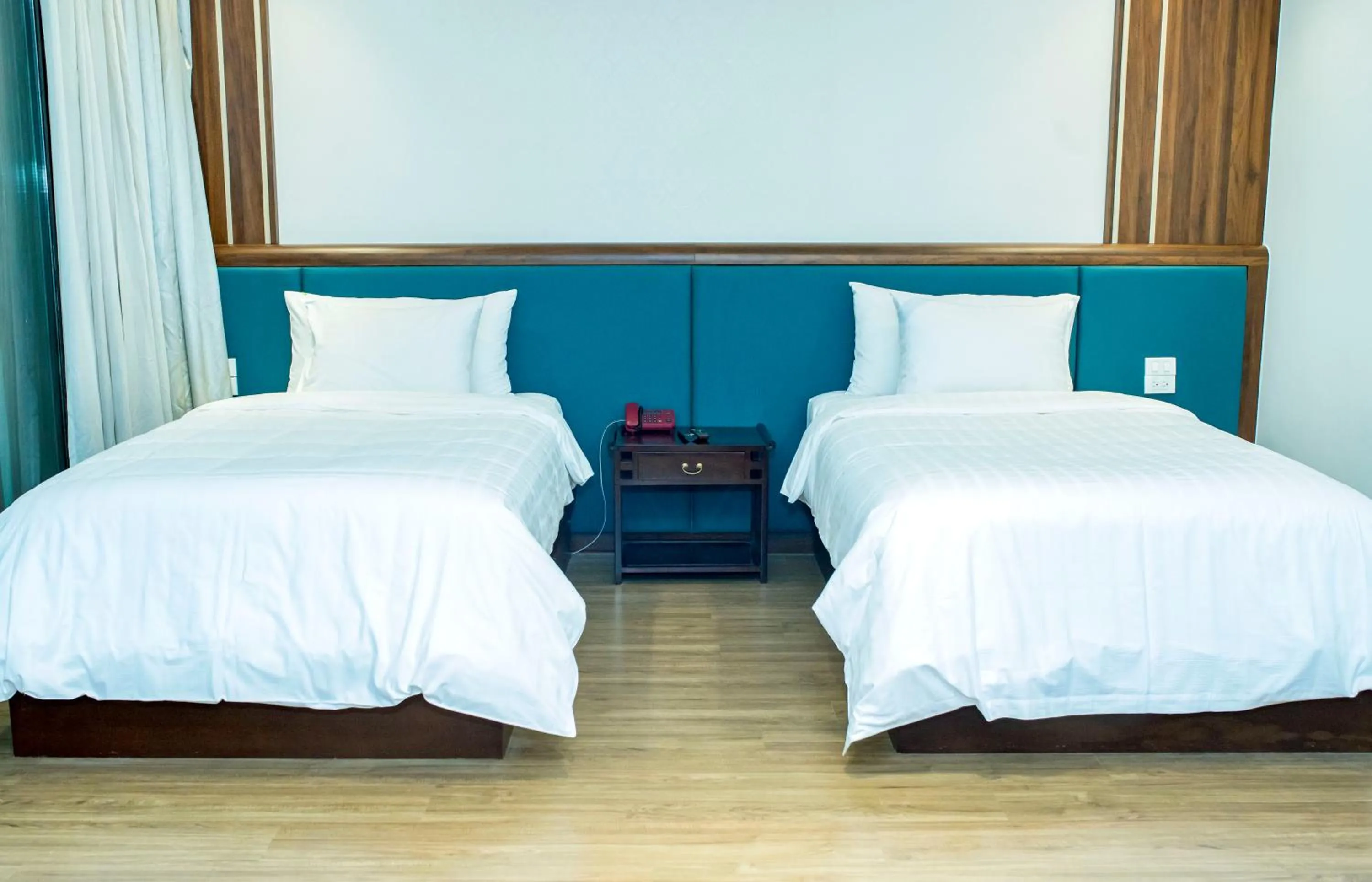 Bed in NCC Garden Villas - NCC Hotel