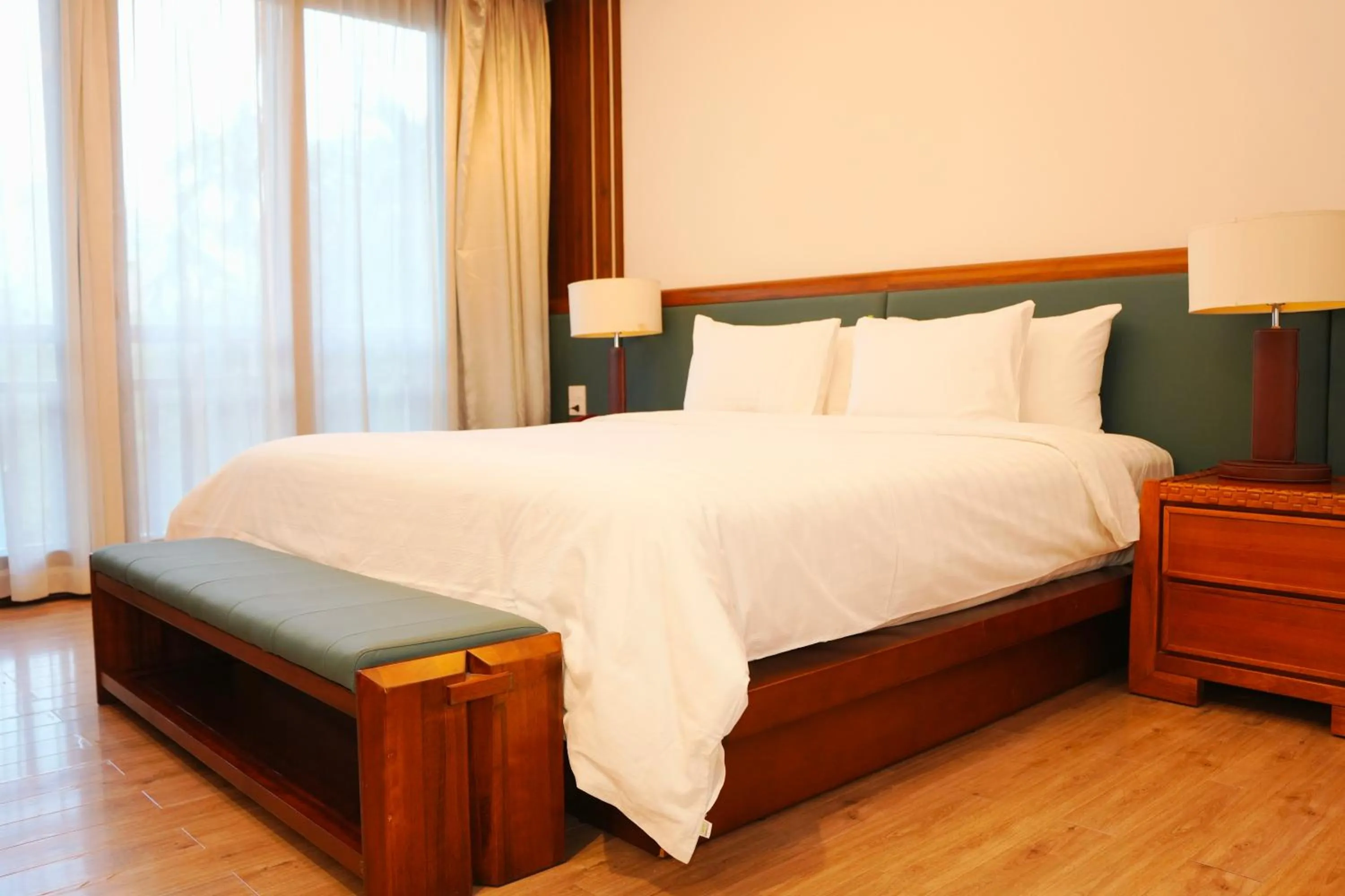 Bed in NCC Garden Villas - NCC Hotel