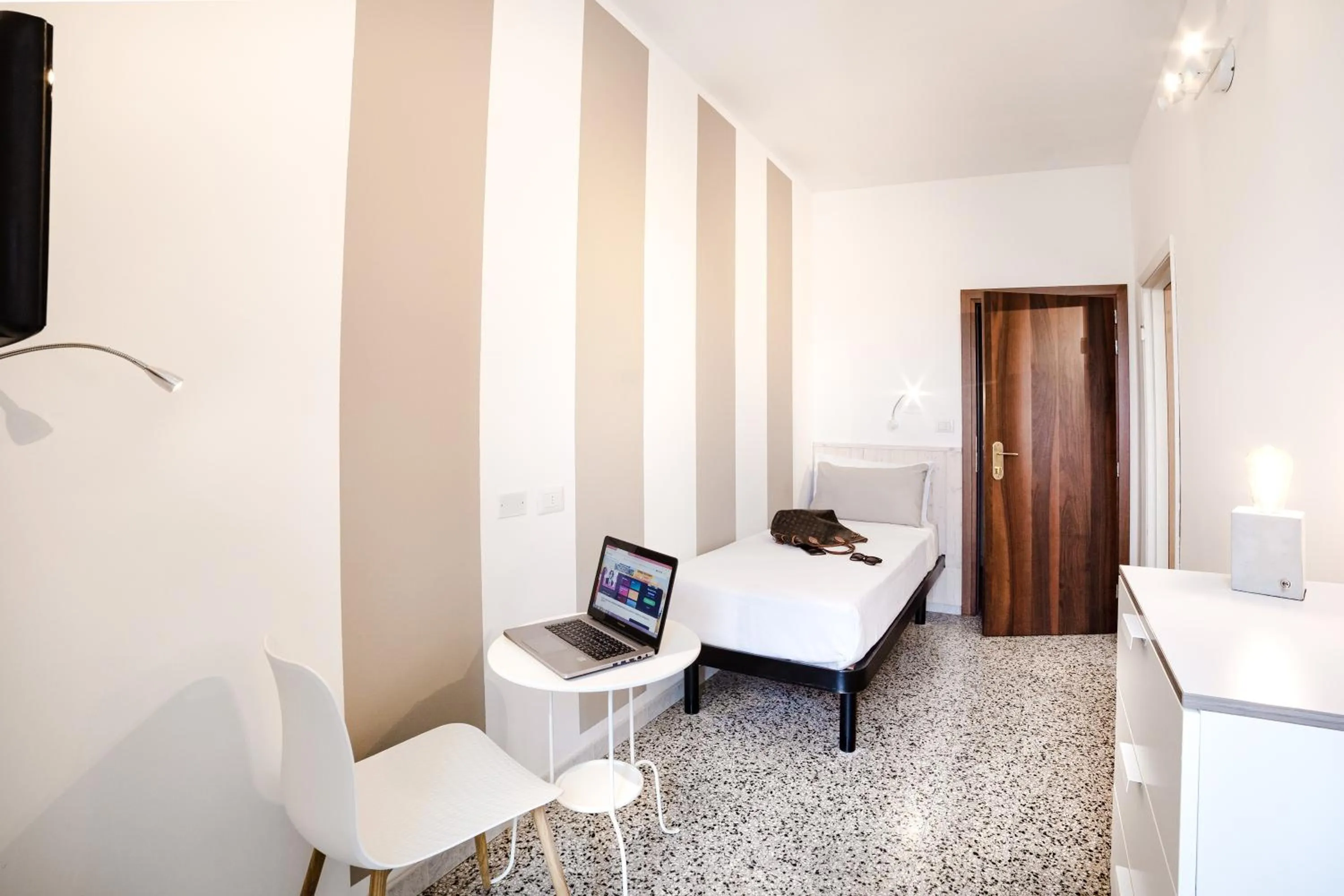 Bed in De La Ville Hotel