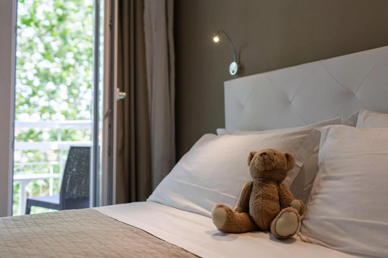 Bed in De La Ville Hotel