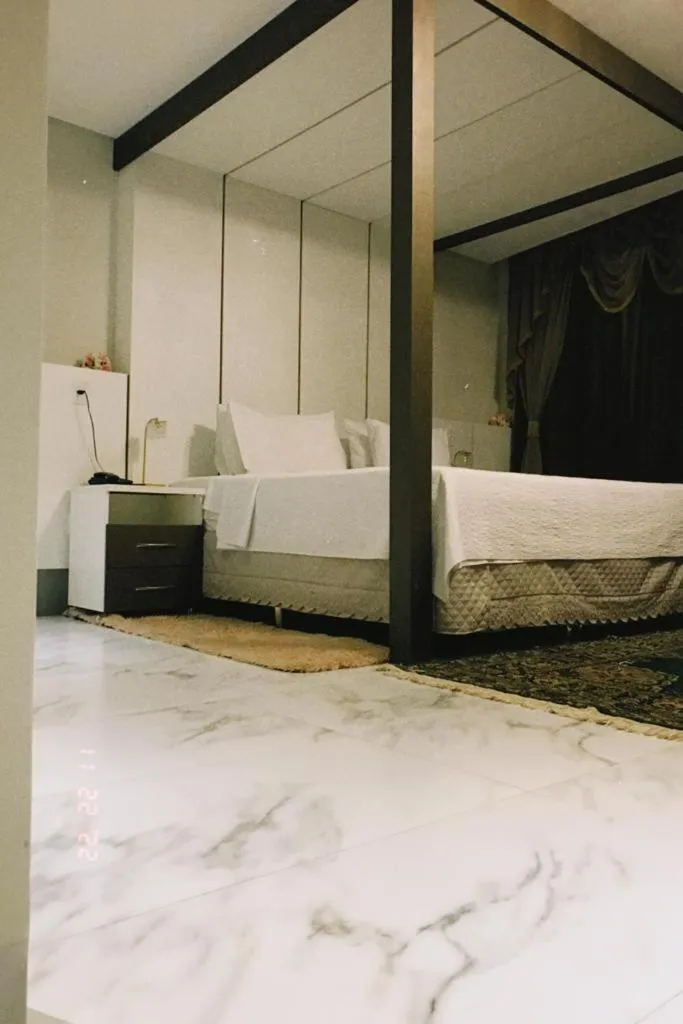 Bed in Pak Suítes Hotel