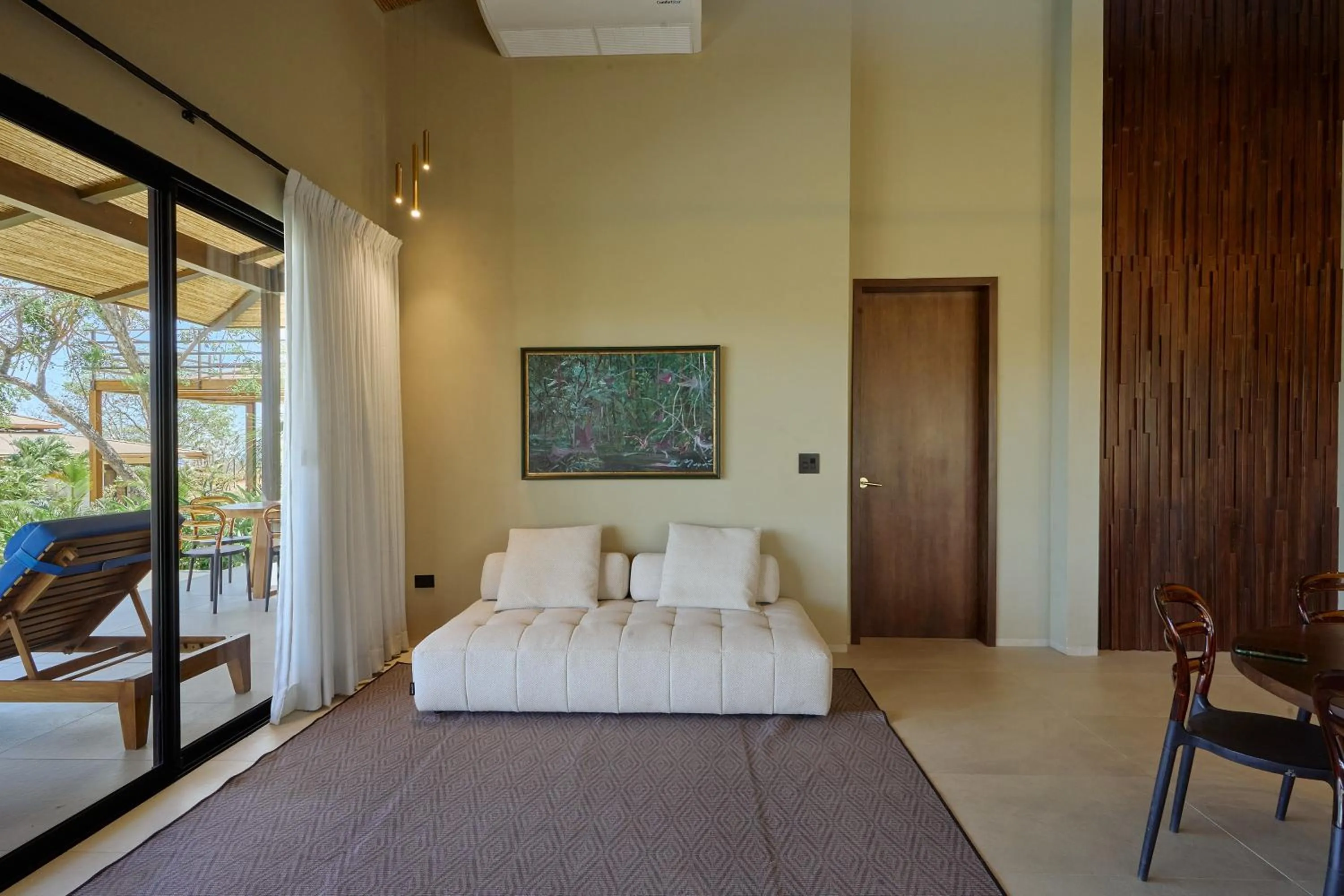 Living room, Bed in TreeCasa Hotel & Resort Nicaragua