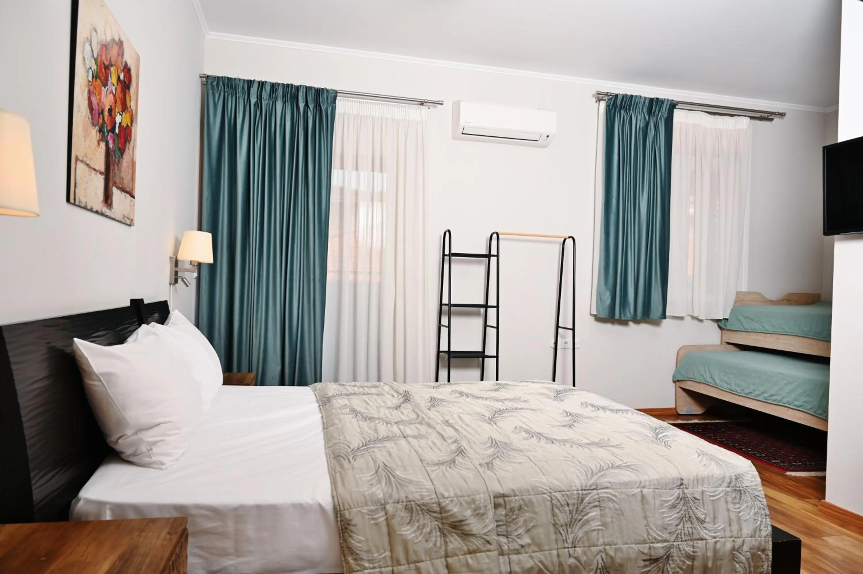 Bed in Le Bijou Luxury Rooms & Suites